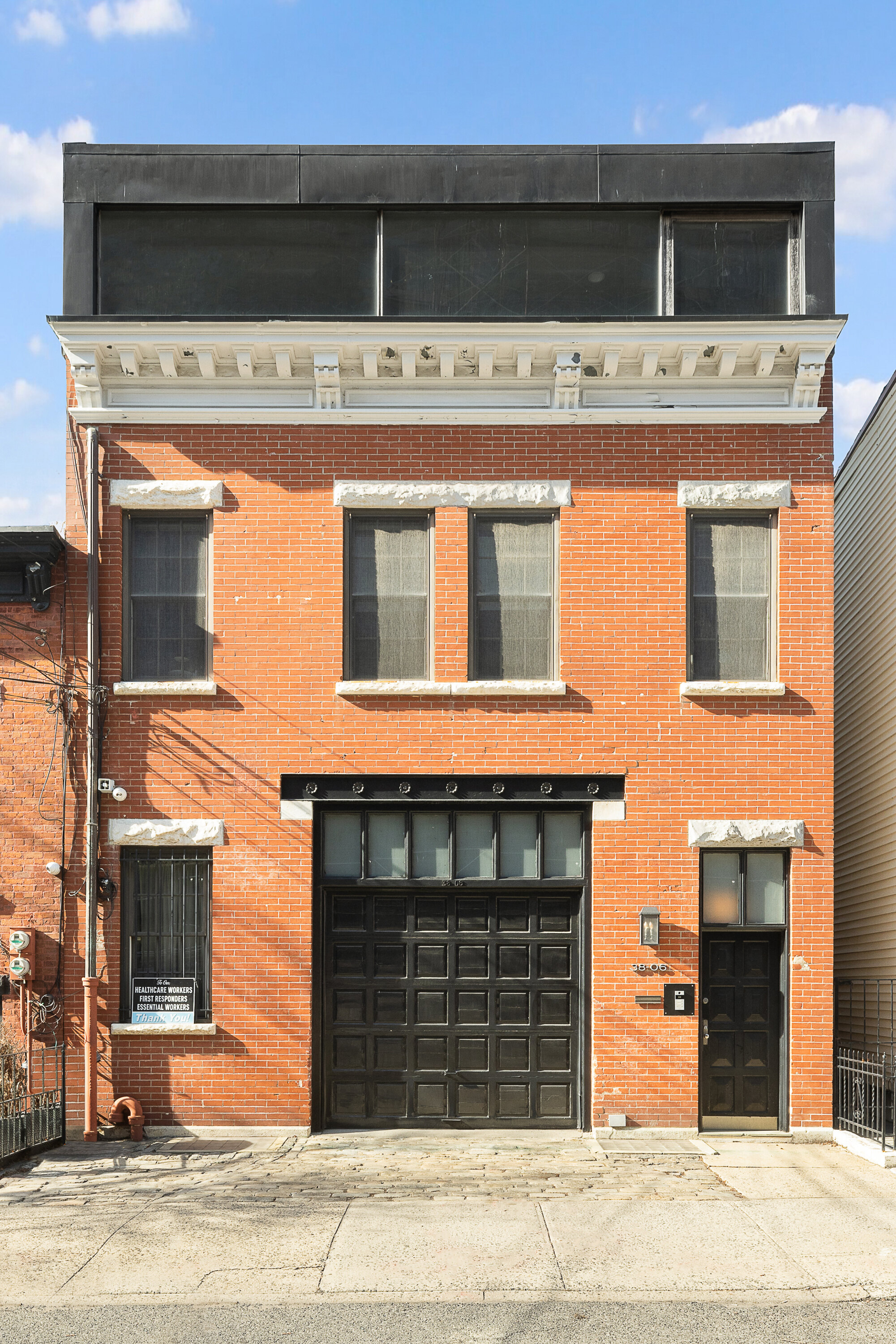 38-06 28th Street, Unit 1 Queens, NY 11101 - Photo 7 of 8 a view of a building with a refrigerator and a stove