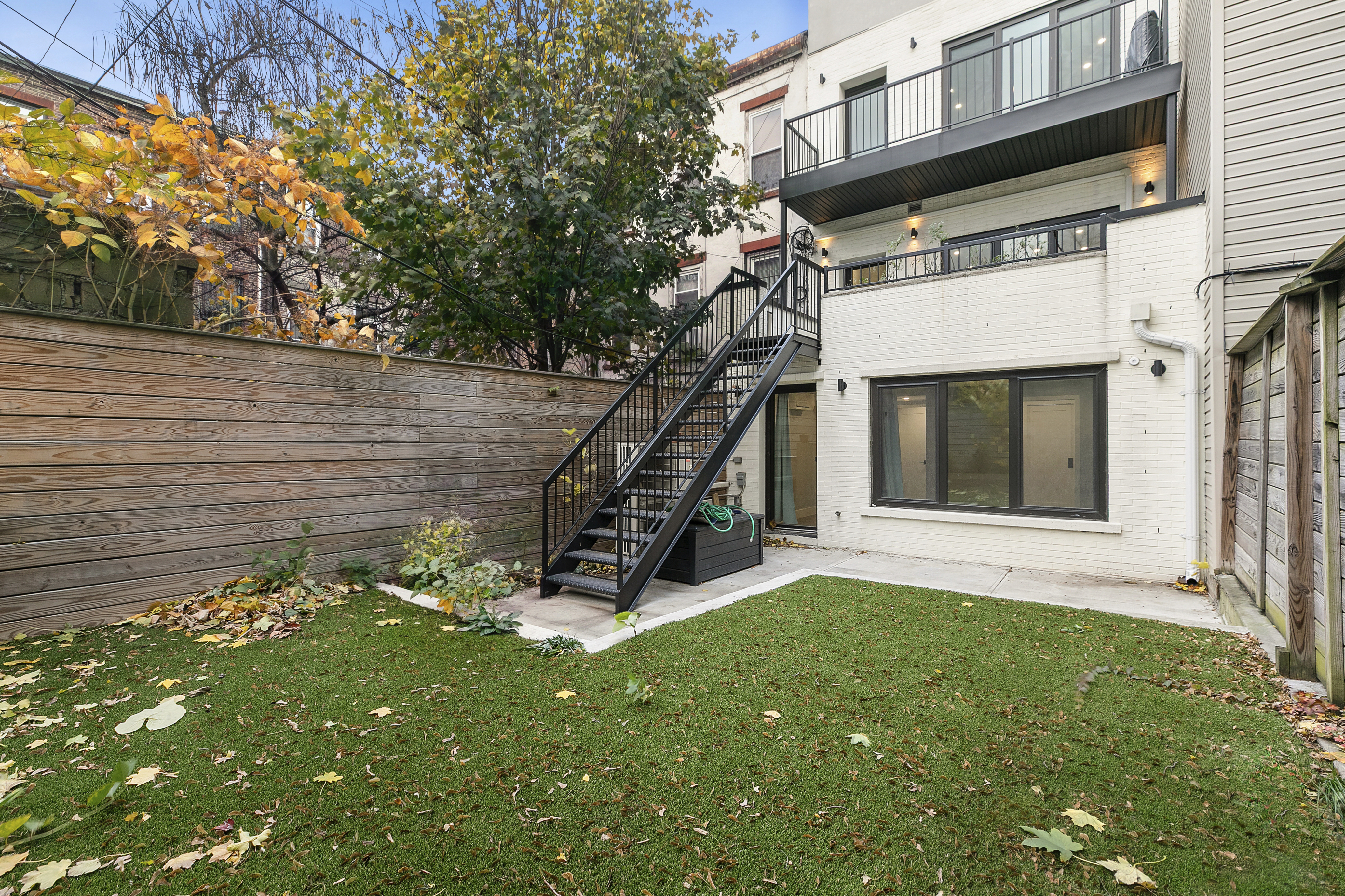 434 Throop Avenue, Unit 2 Brooklyn, NY 11221 - Photo 17 of 20 a view of an house with backyard and a tree