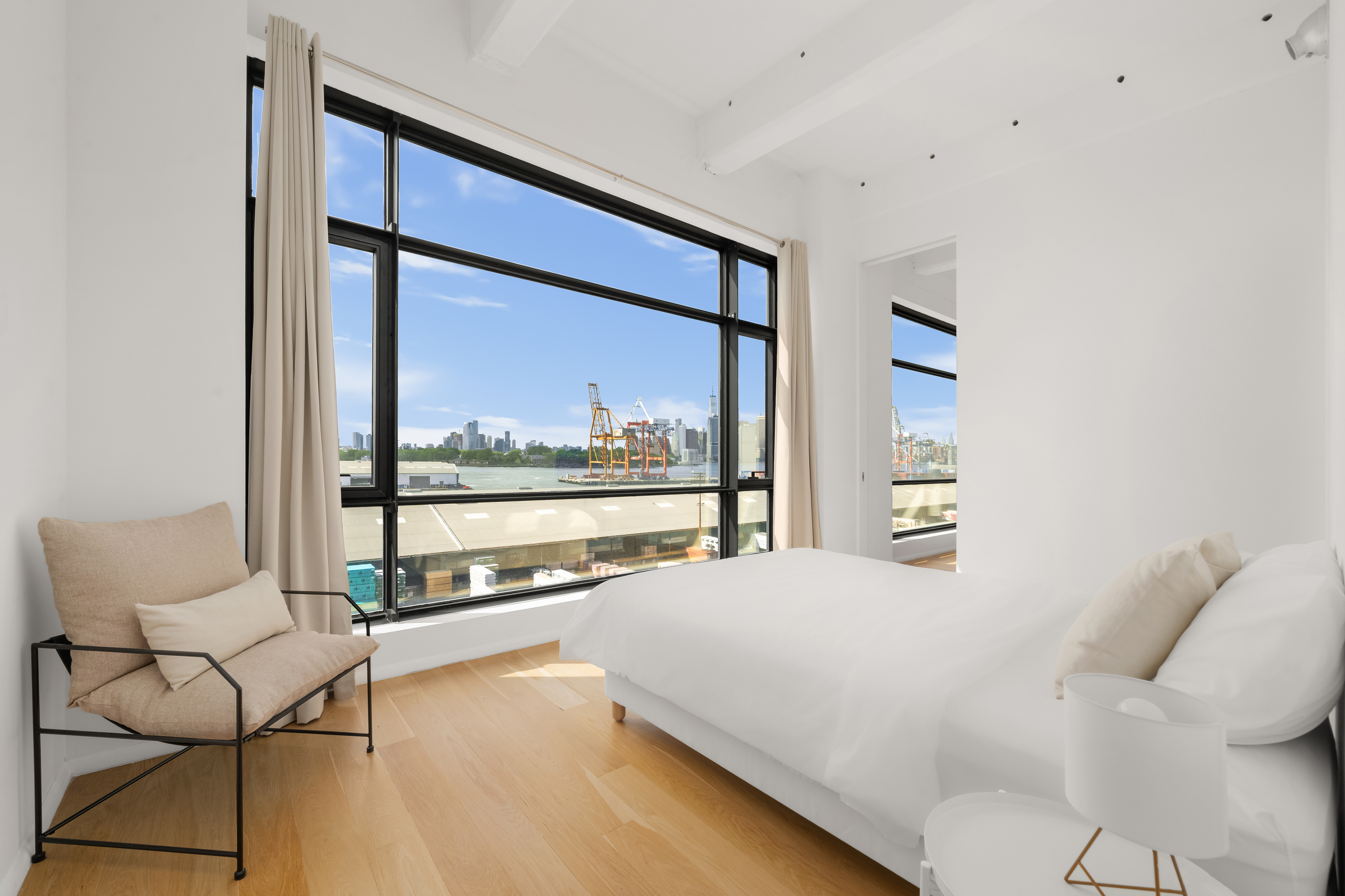 160 Imlay Street, Unit 5A2 Brooklyn, NY 11231 - Photo 5 of 14 a bedroom with a bed and large window