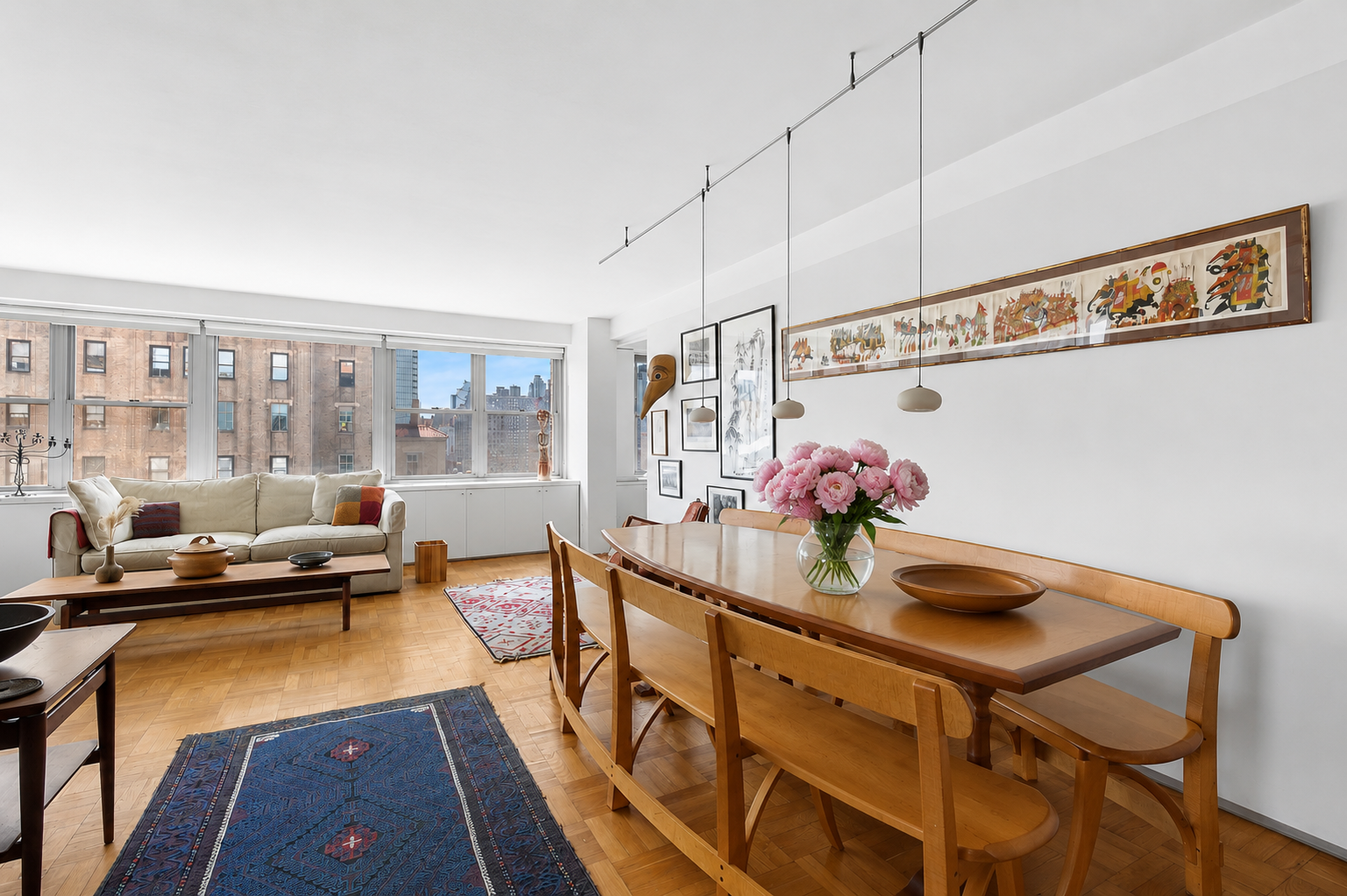 15 West 72nd Street, Unit 25F Manhattan, NY 10023 - Photo 3 of 12 a view of a room that has a table and chairs