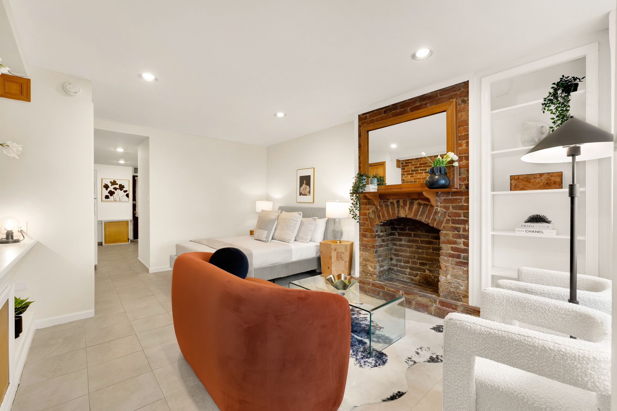 903 F Street Northeast Washington, DC 20002 - Photo 26 of 41 a living room with furniture a fireplace and a flat screen tv