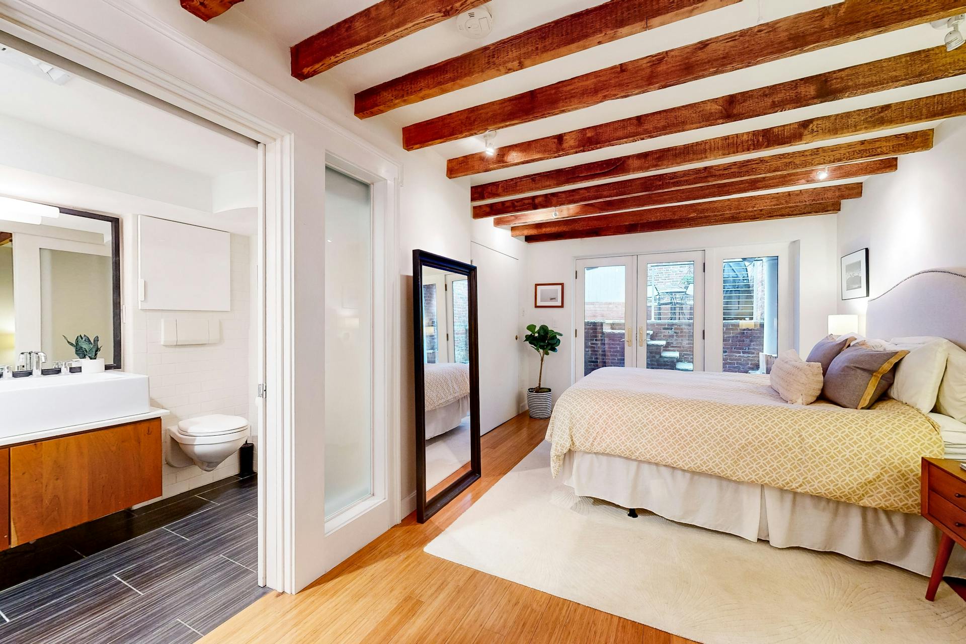 11 Fayette Street, Unit 1 Boston, MA 02116 - Photo 16 of 33 a bedroom with a bed and a mirror