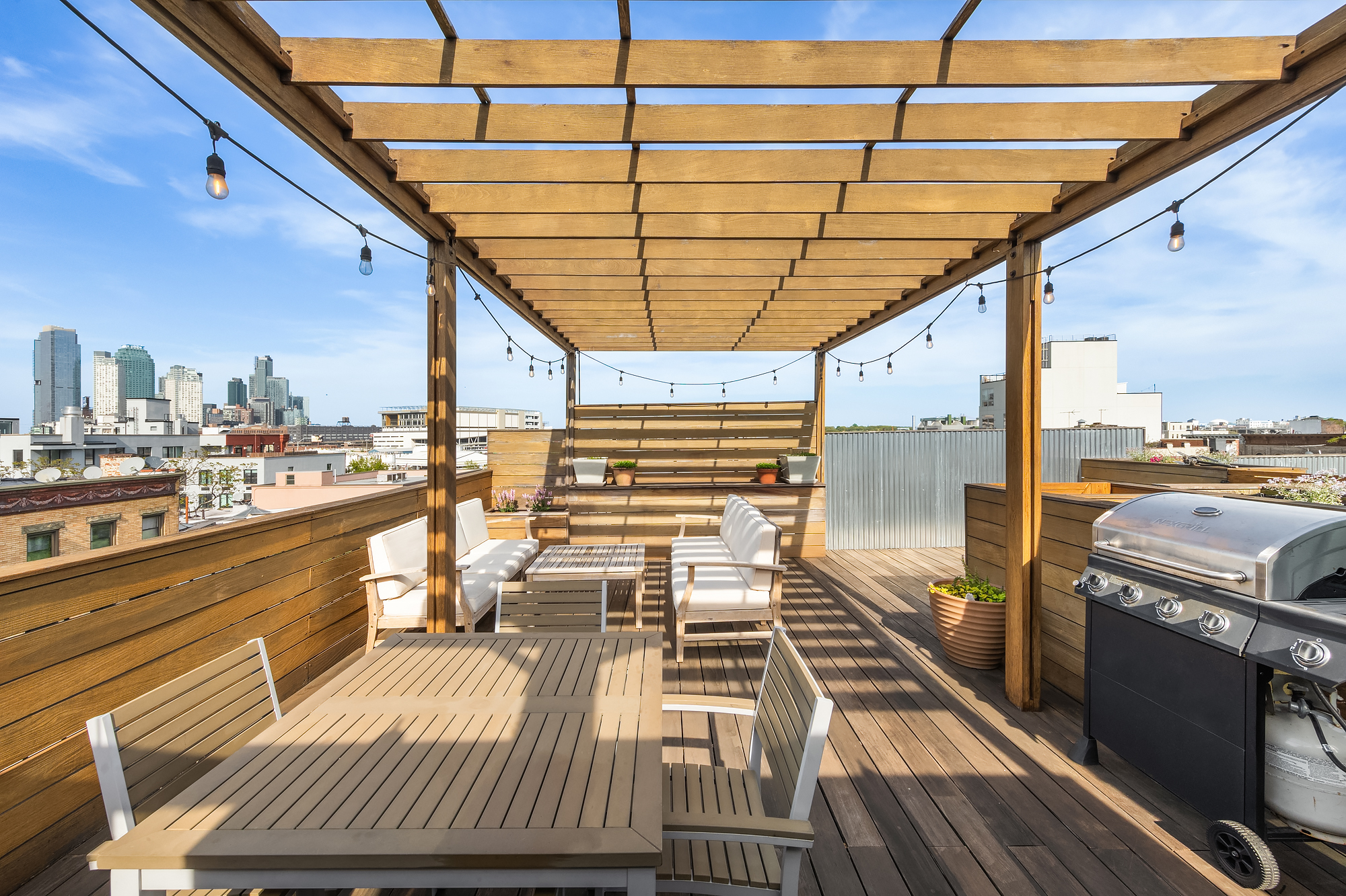 102 Clay Street, Unit 4 Brooklyn, NY 11222 - Photo 10 of 13 a view of a balcony with wooden floor