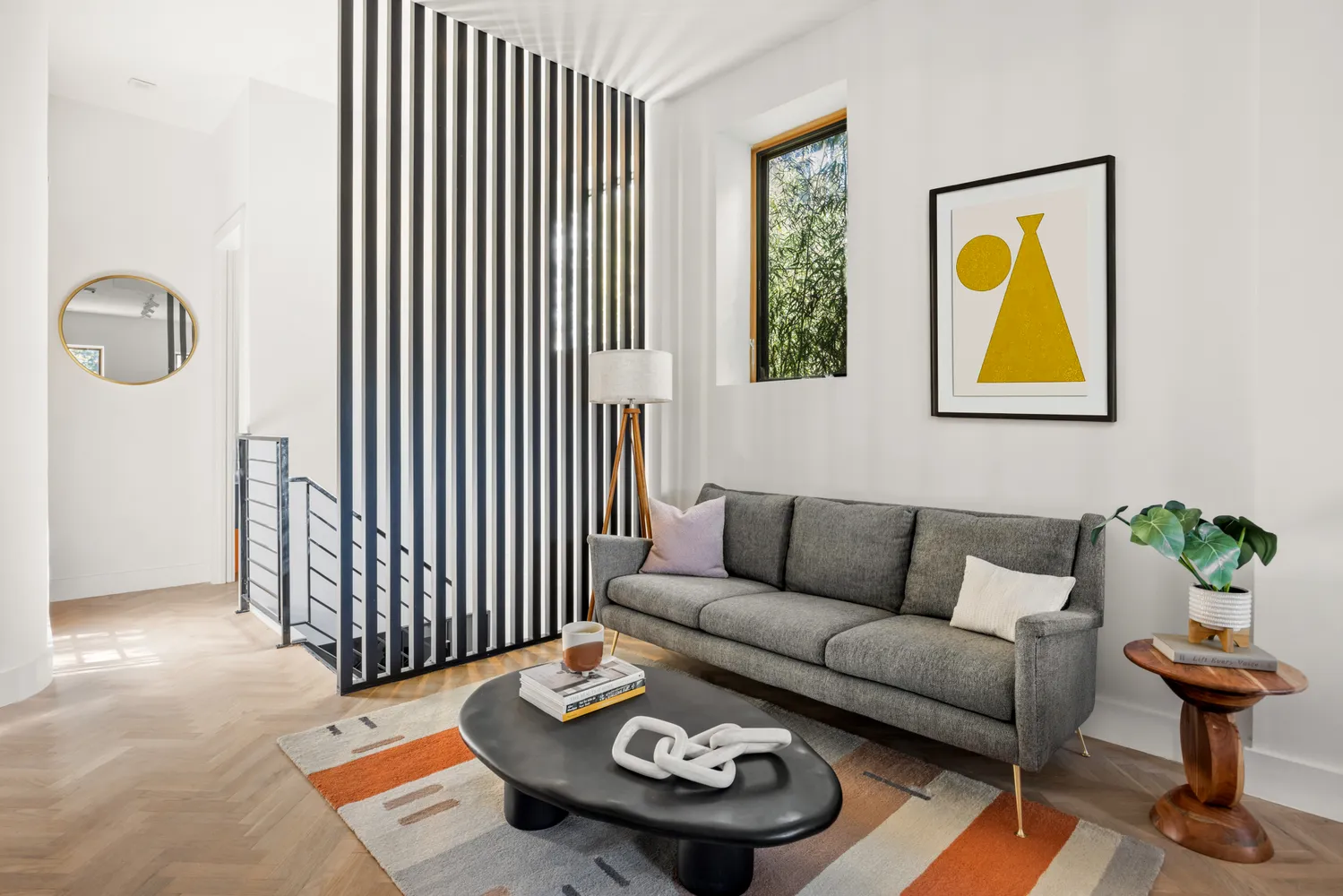 a living room with furniture and a rug