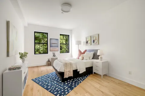 a room with a bed and a window