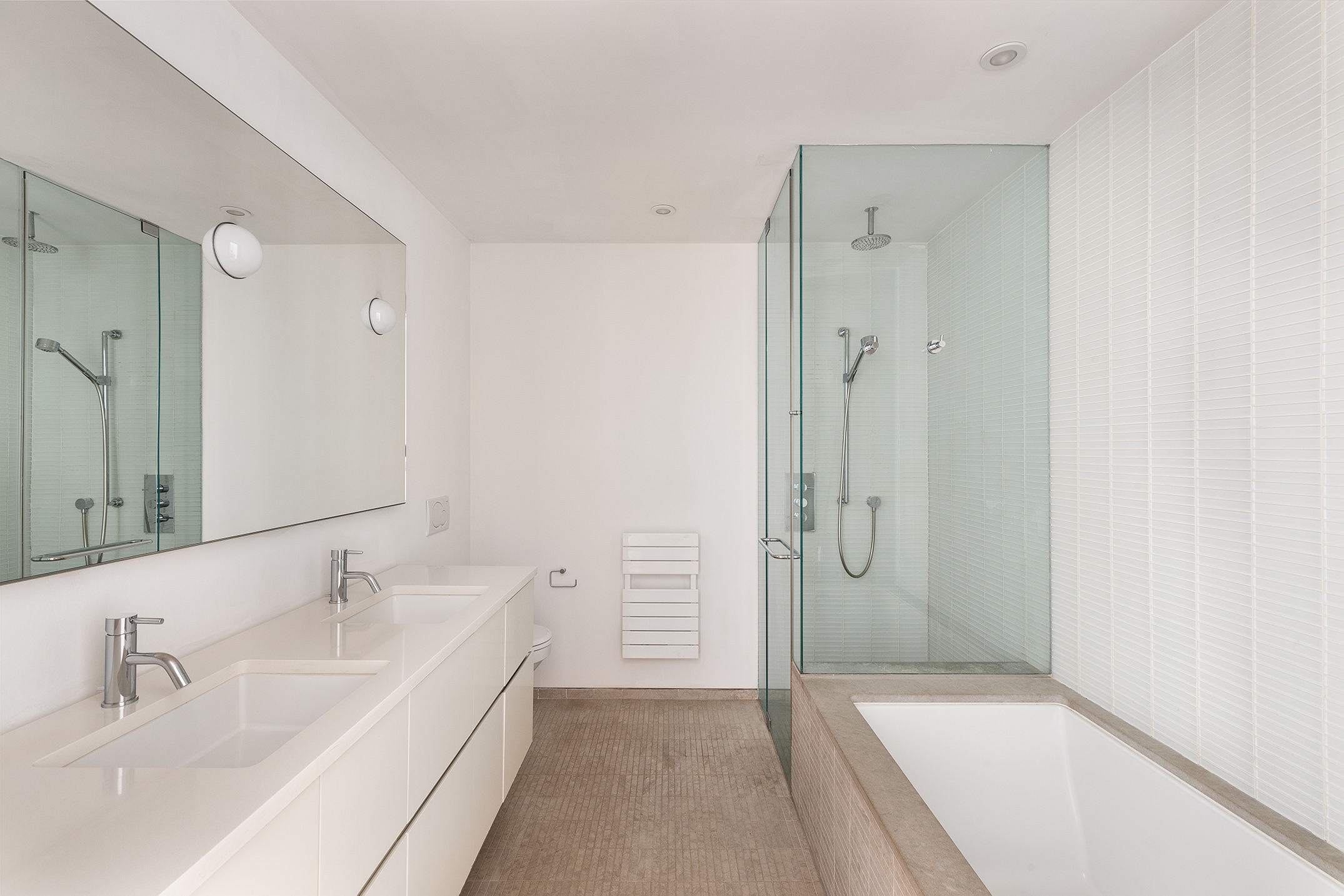 136 Baxter Street, Unit 3C Manhattan, NY 10013 - Photo 11 of 15 a bathroom with a tub sink shower and mirror