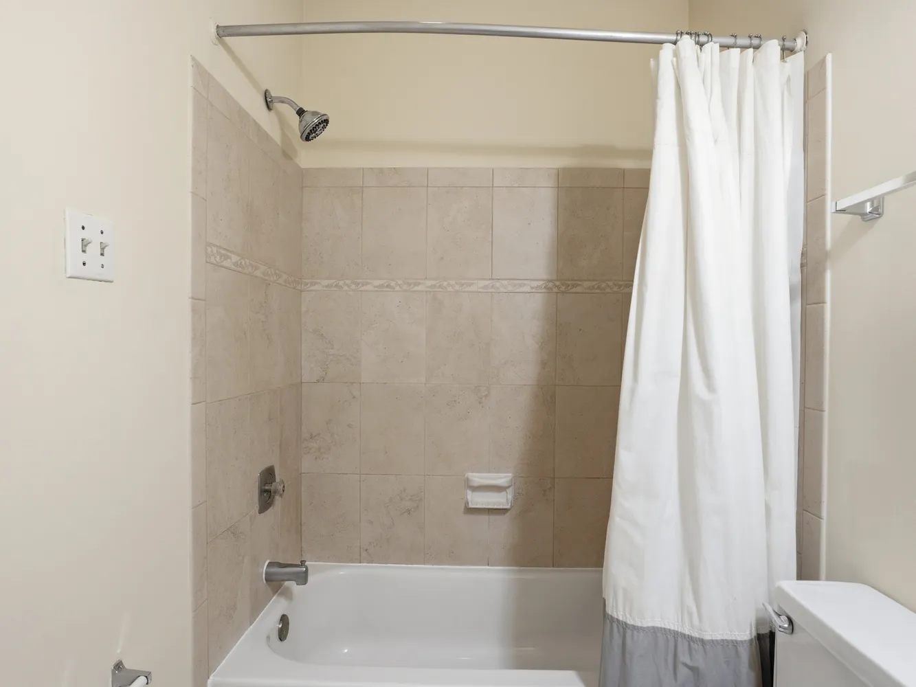 a bathroom with a shower and a tub