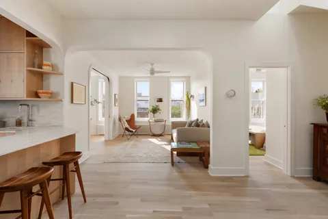 a living room with furniture and a table
