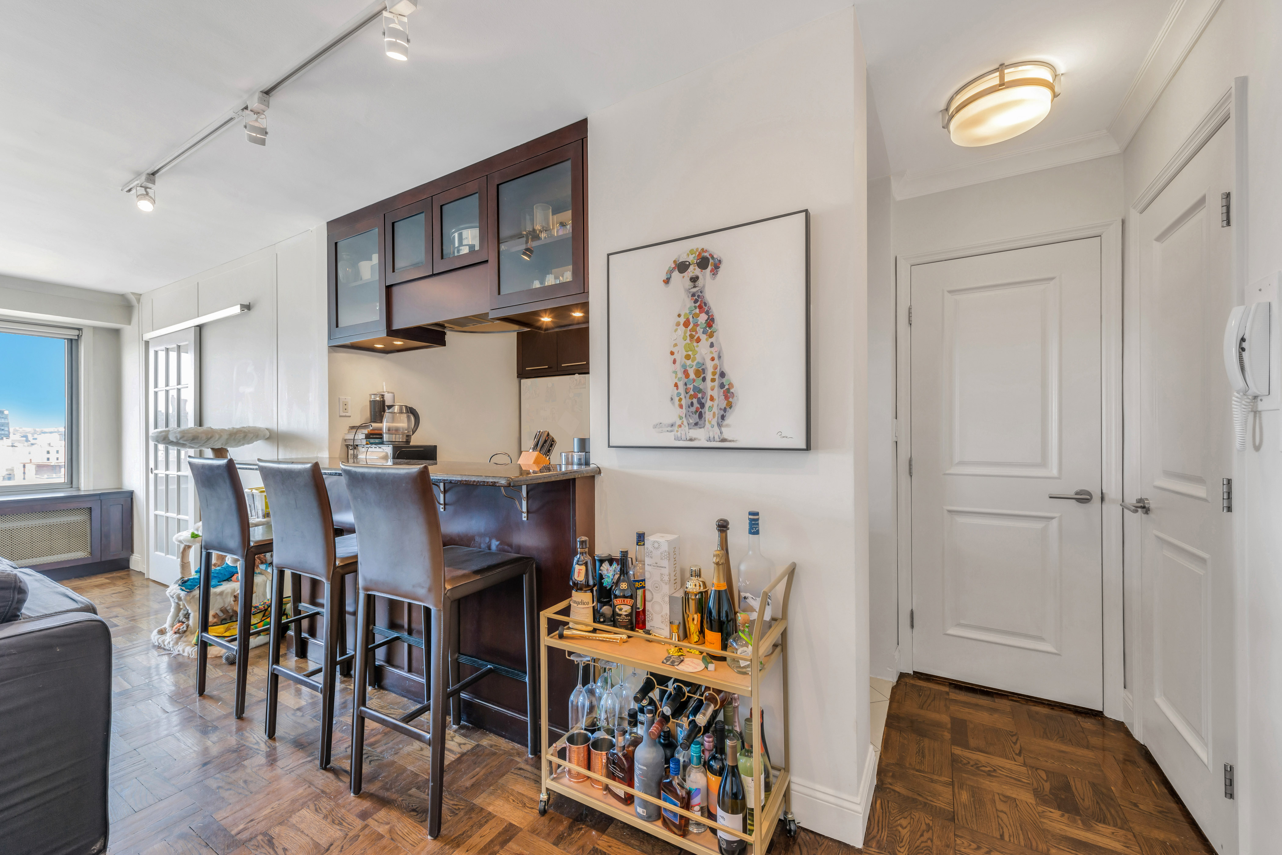 175 West 12th Street, Unit 12F Manhattan, NY 10011 - Photo 4 of 10 a view of a dining room with furniture and a rug