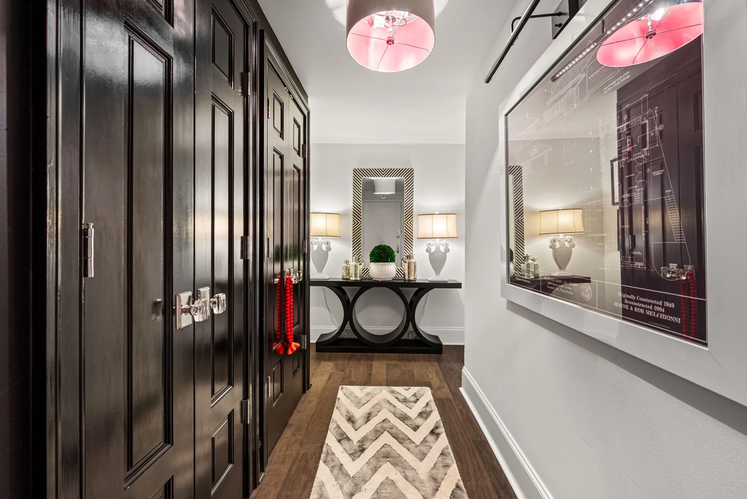 a view of hallway with livingroom and furniture