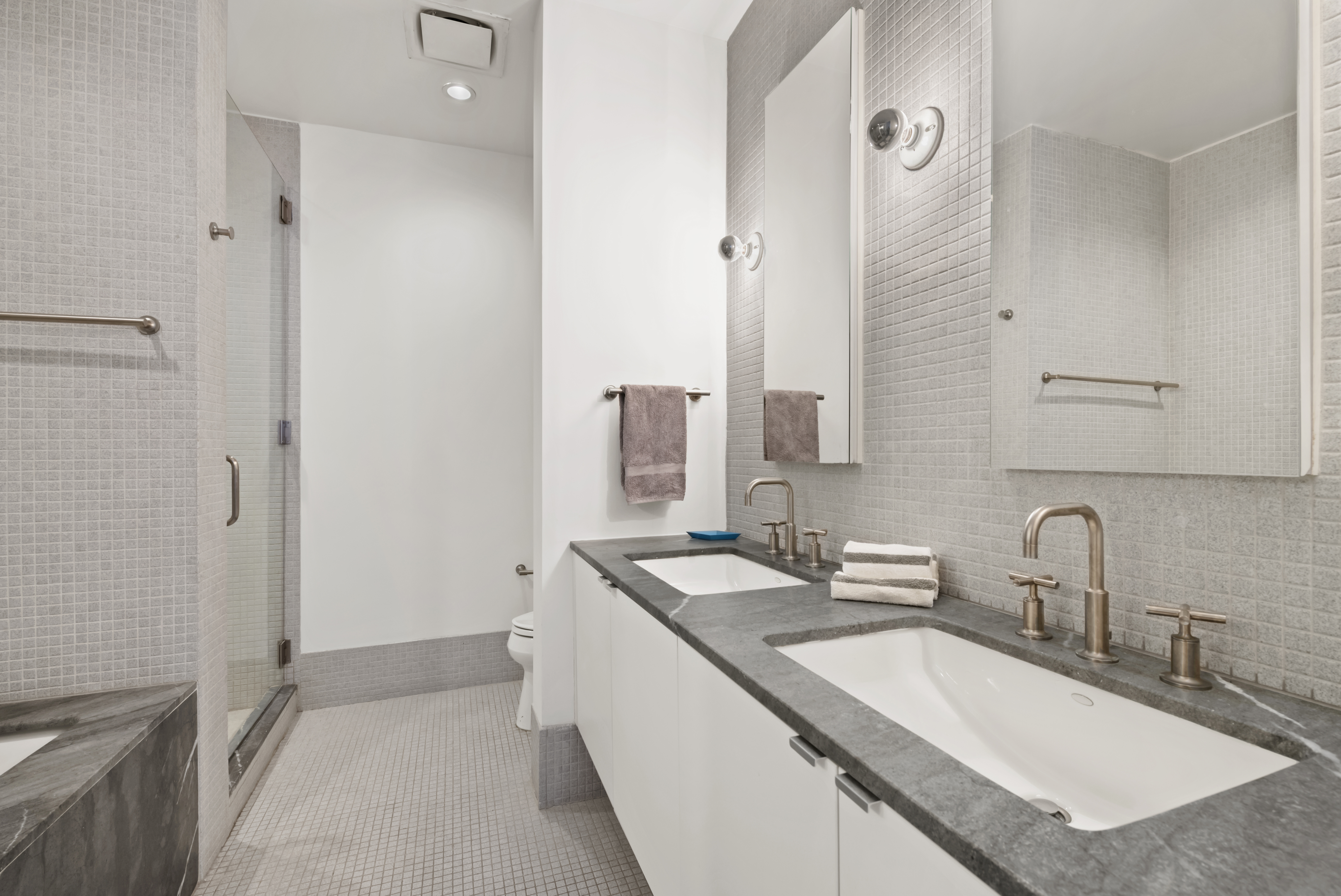 210 Lafayette Street, Unit 6D Manhattan, NY 10012 - Photo 6 of 8 a bathroom with a sink and a mirror