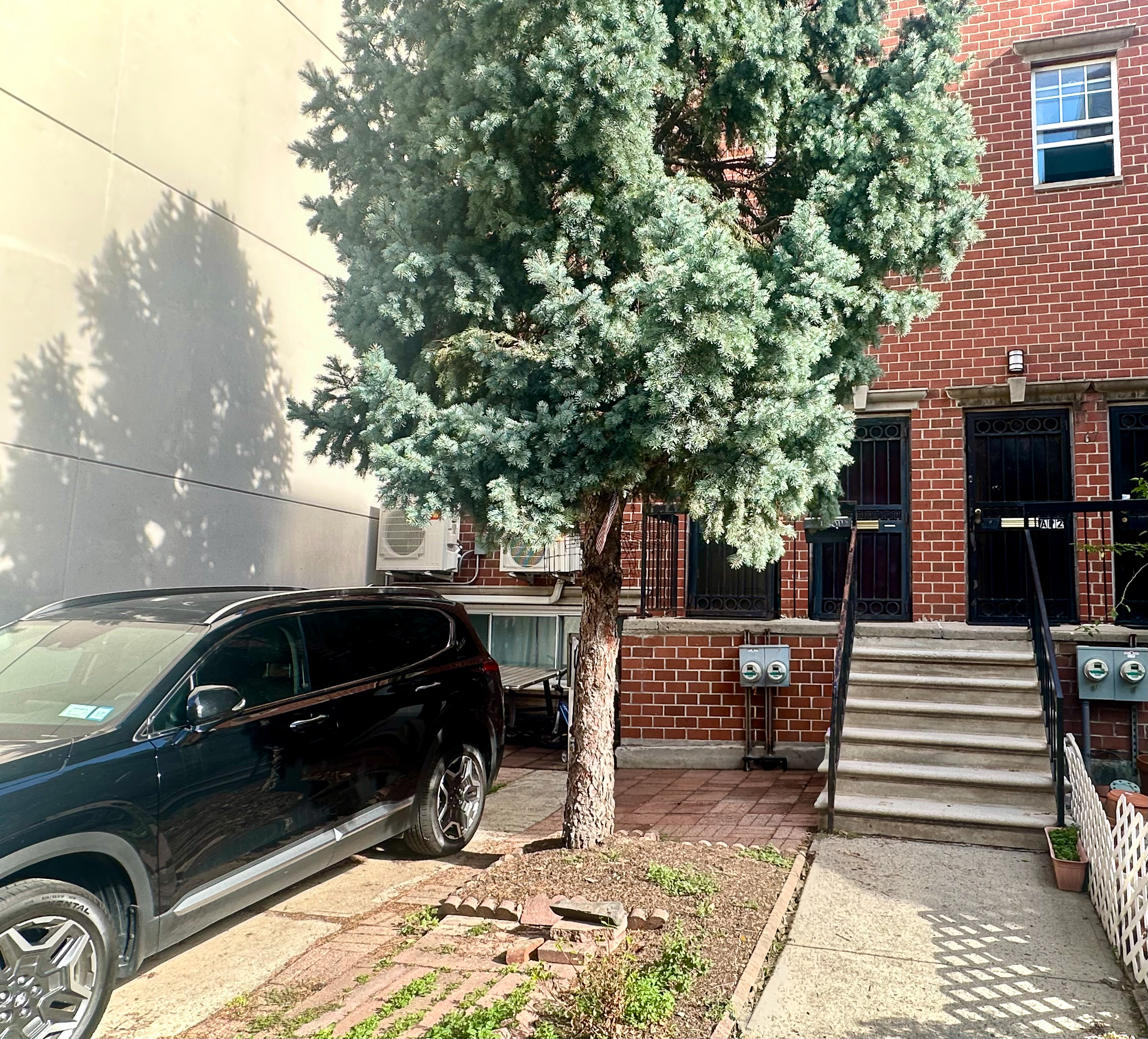 65 South 4th Street, Unit 2 Brooklyn, NY 11249 - Photo 11 of 12 a view of a car parked in the back yard