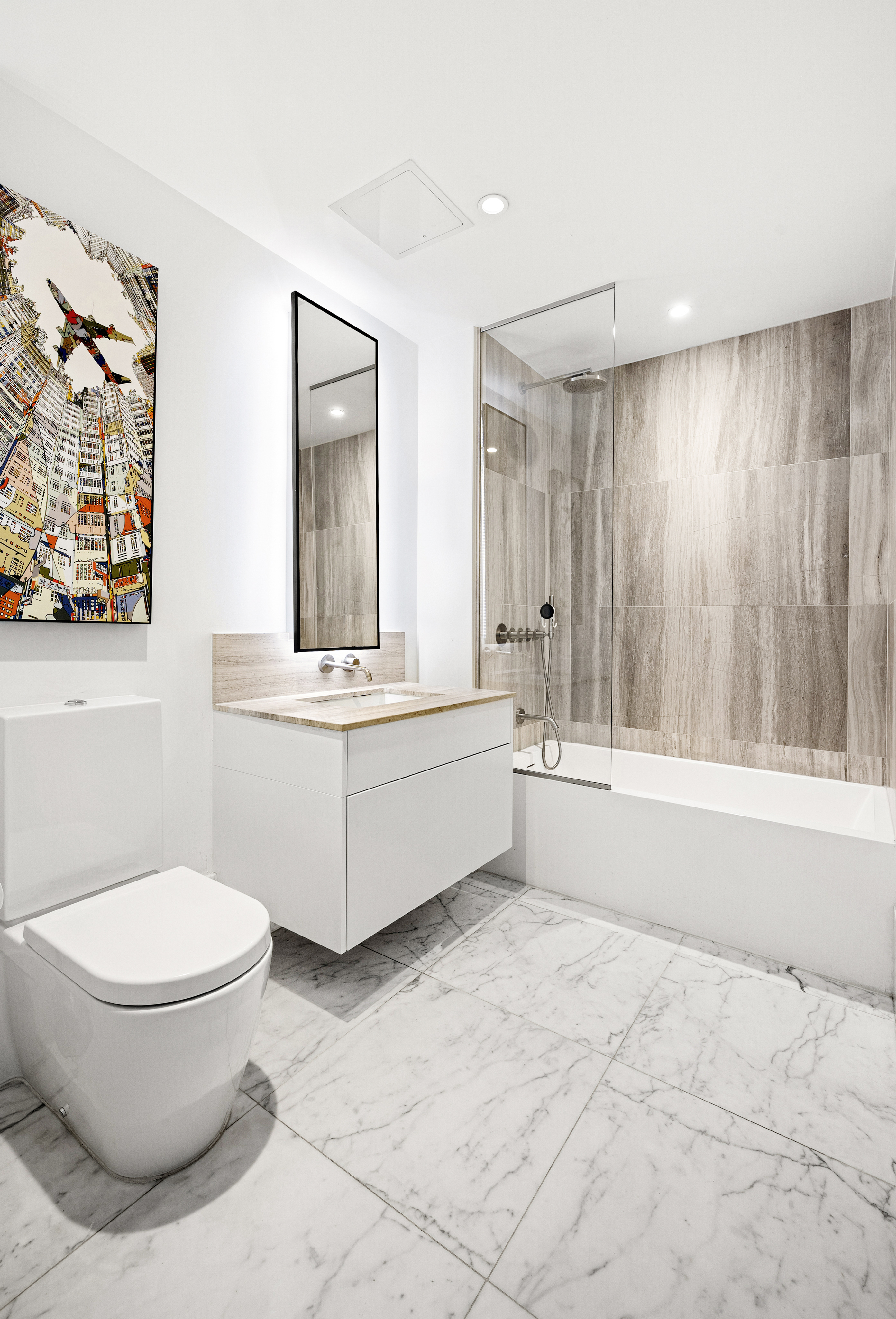 429 Kent Avenue, Unit 340 Brooklyn, NY 11249 - Photo 7 of 9 a bathroom with a sink toilet and shower