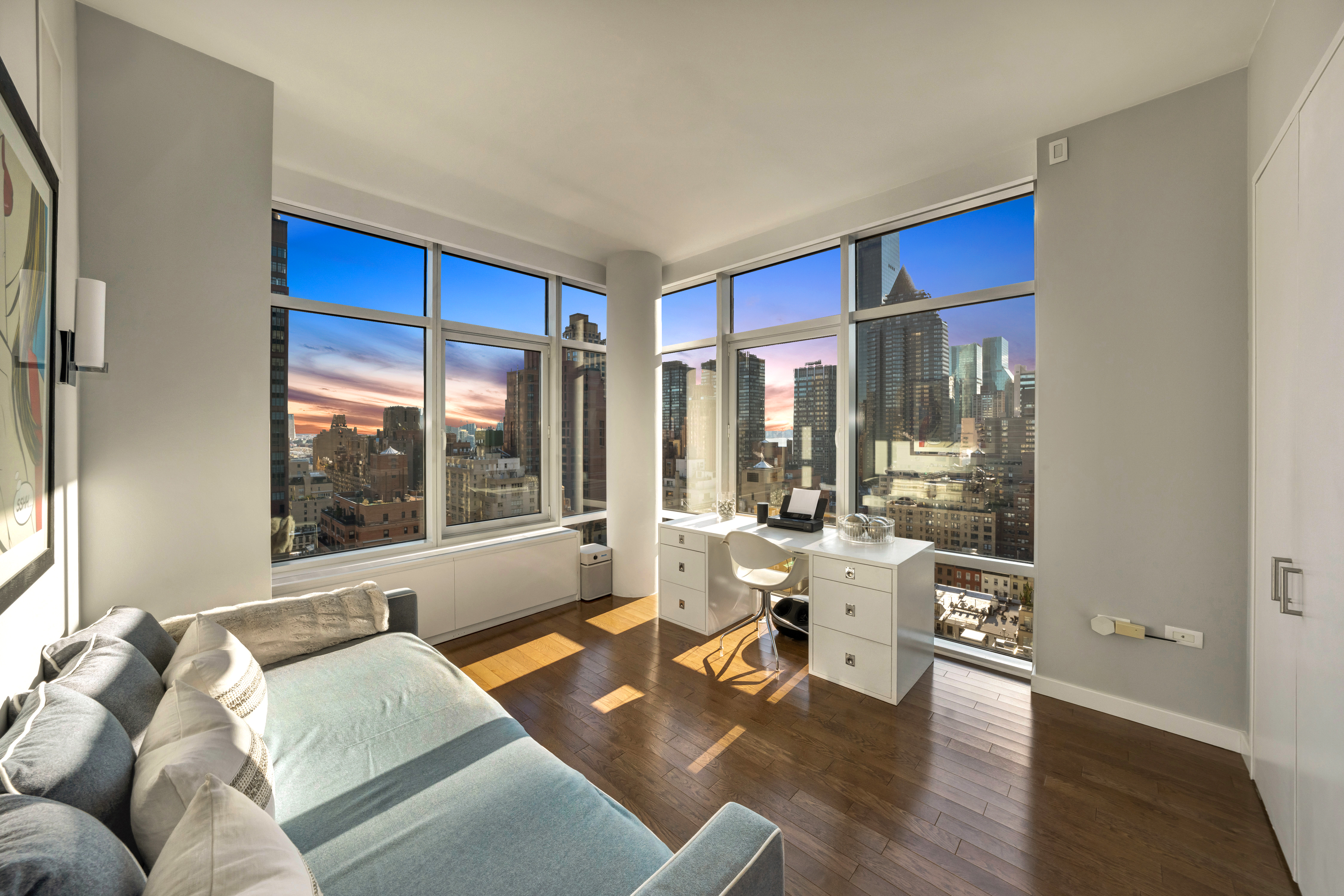 310 East 53rd Street, Unit 18A Manhattan, NY 10022 - Photo 15 of 19 a living room with furniture and a large window