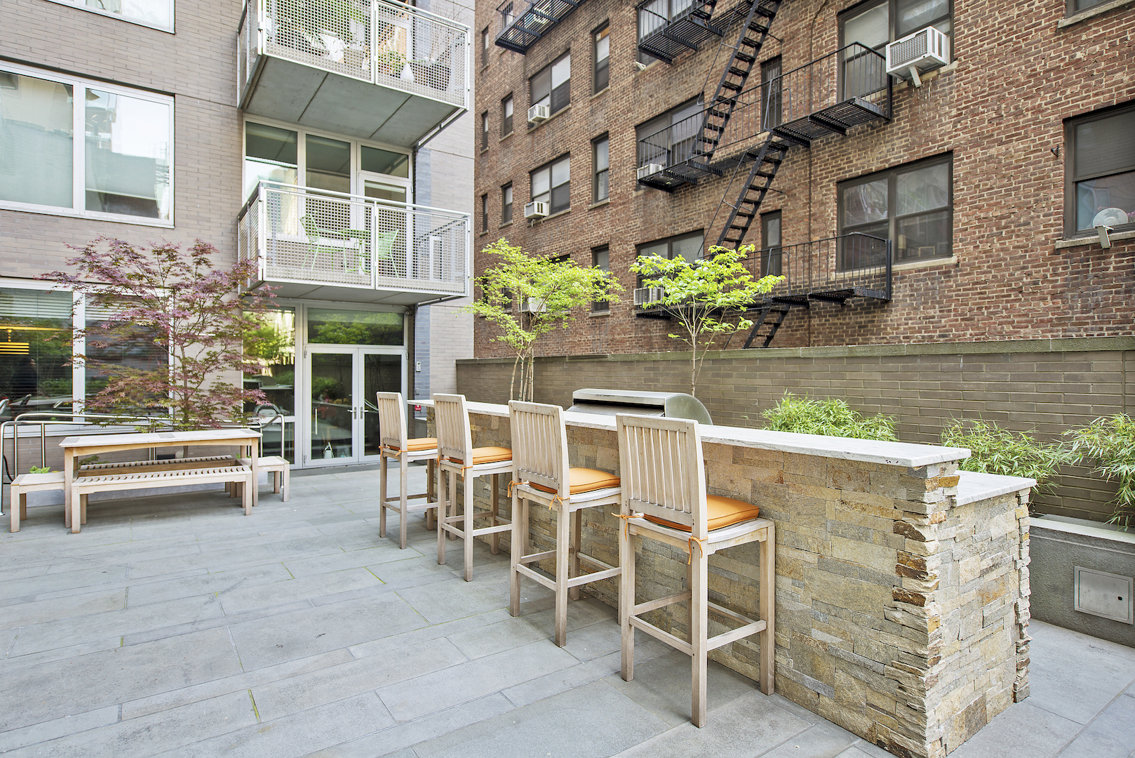 225 East 34th Street, Unit 3H Manhattan, NY 10016 - Photo 14 of 18 a patio with table and chairs