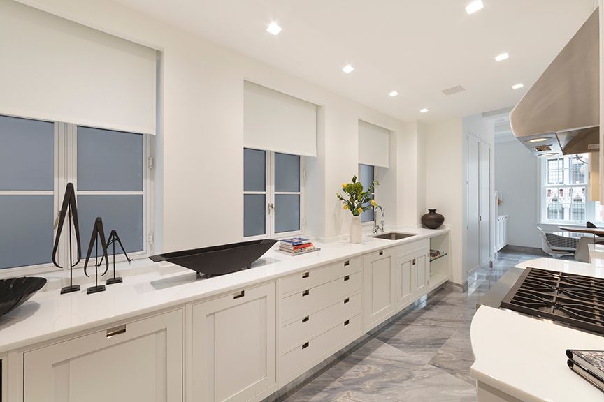 a spacious bathroom with double sink and a large mirror