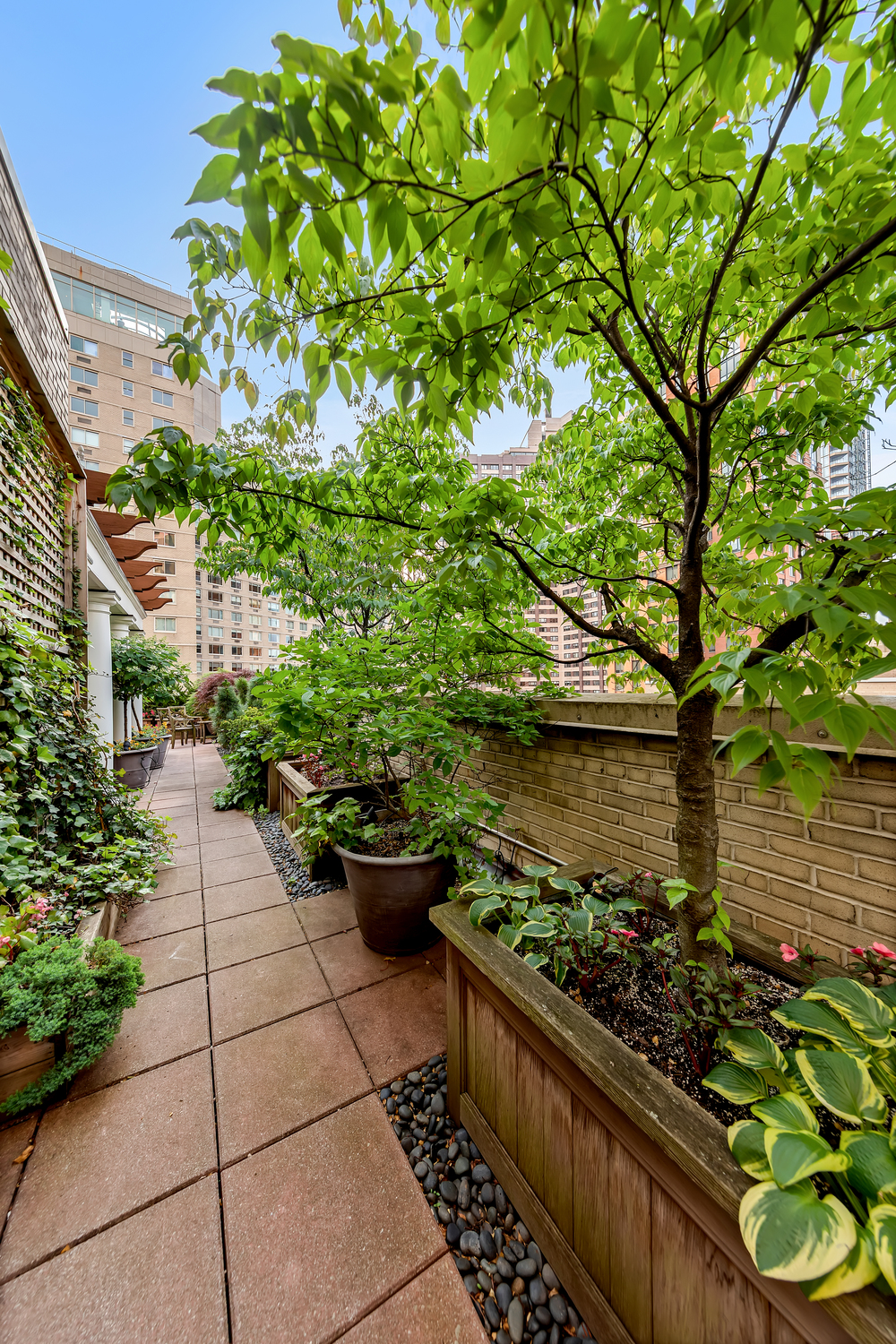 25 Central Park West, Unit 21J Manhattan, NY 10023 - Photo 9 of 37 a view of a garden with potted plants