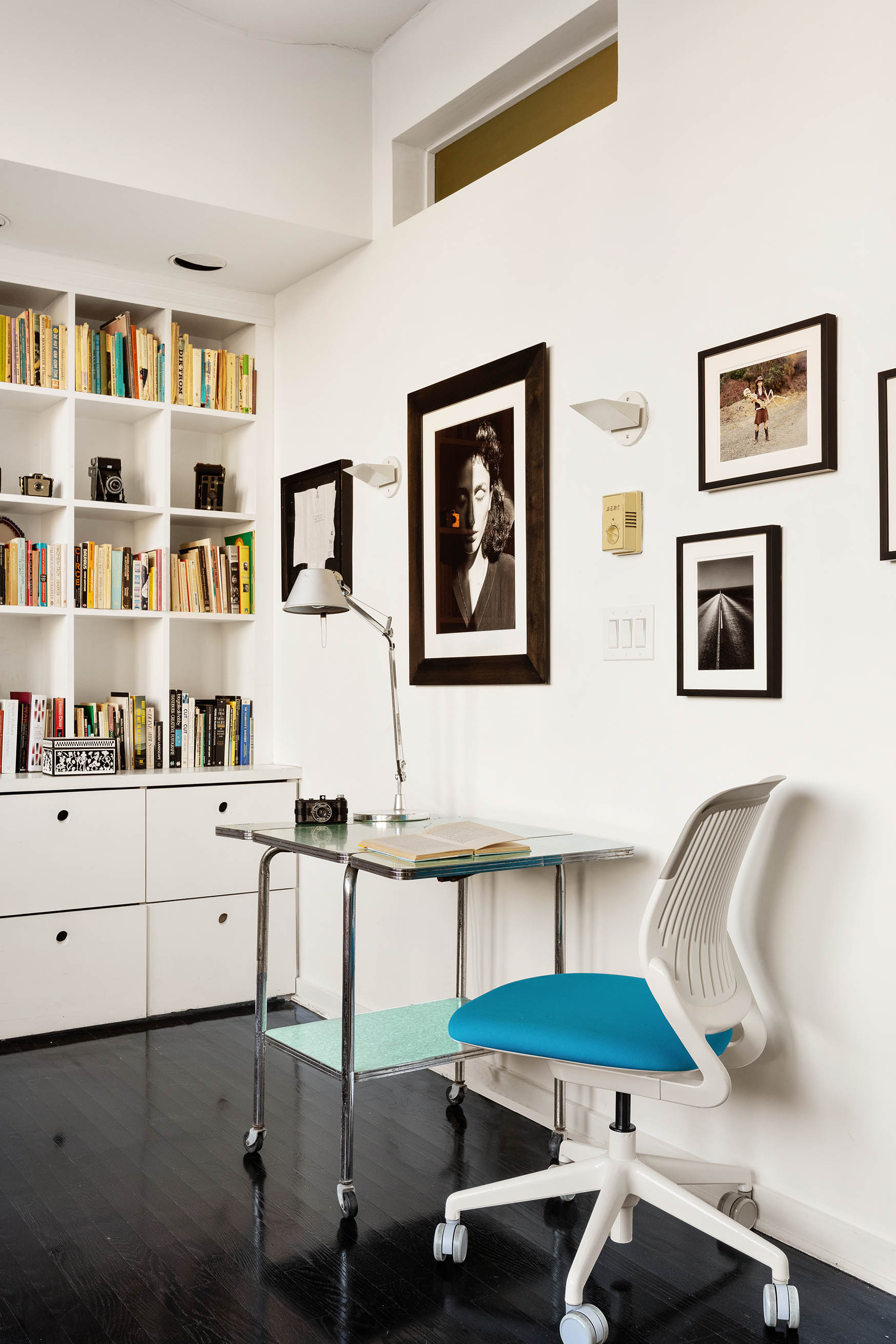 45 Lispenard Street, Unit 3E Manhattan, NY 10013 - Photo 9 of 13 a room with furniture and book shelf
