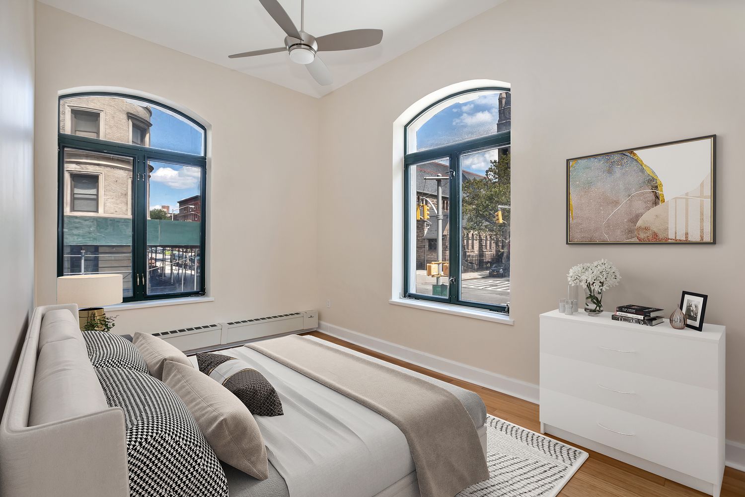 2056 5th Avenue, Unit 2B Manhattan, NY 10035 - Photo 4 of 13 a bedroom with a bed and a large window