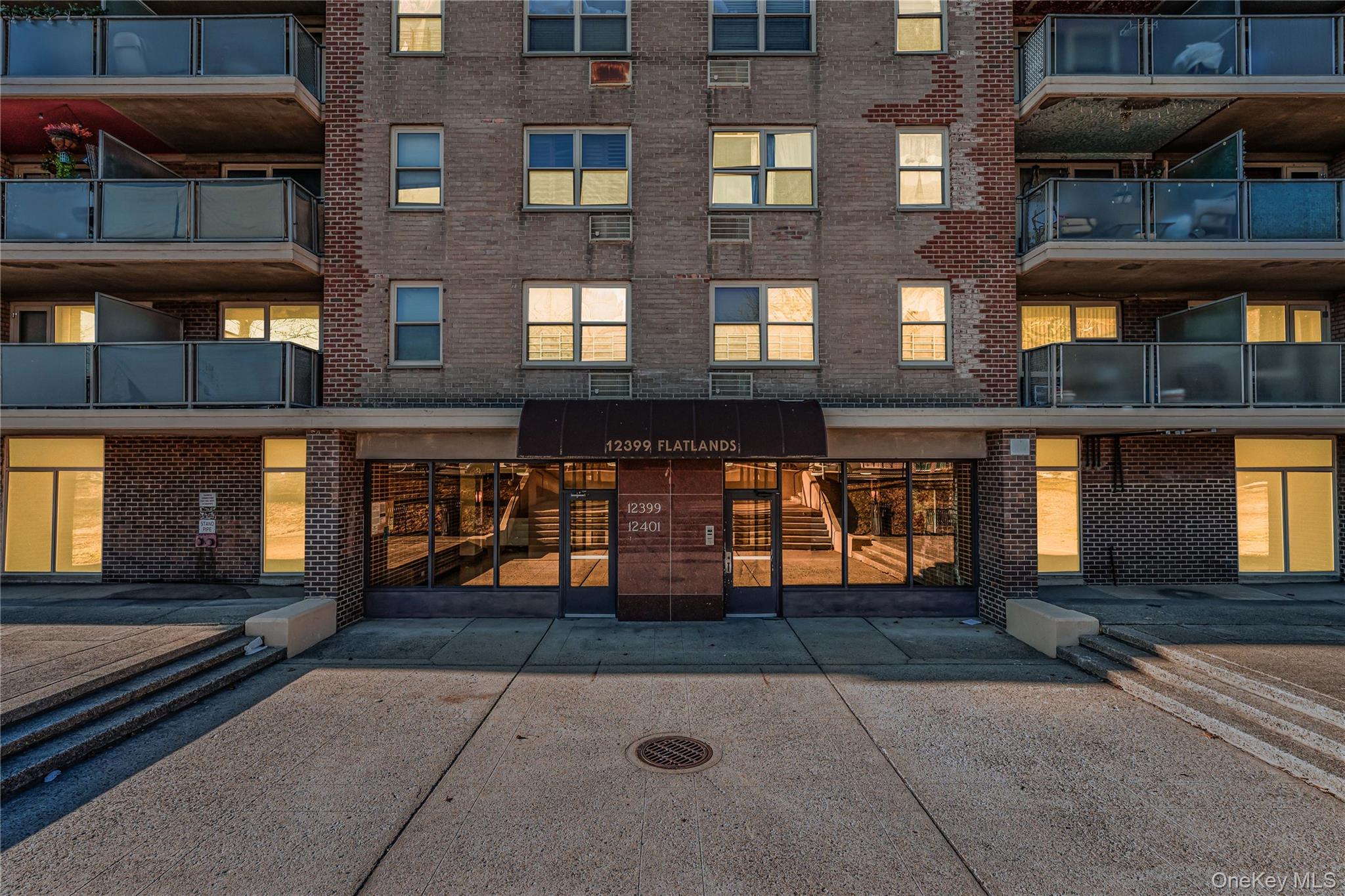 12399 Flatlands Avenue, Unit 1L Brooklyn, NY 11207 - Photo 21 of 21 a front view of building with yard