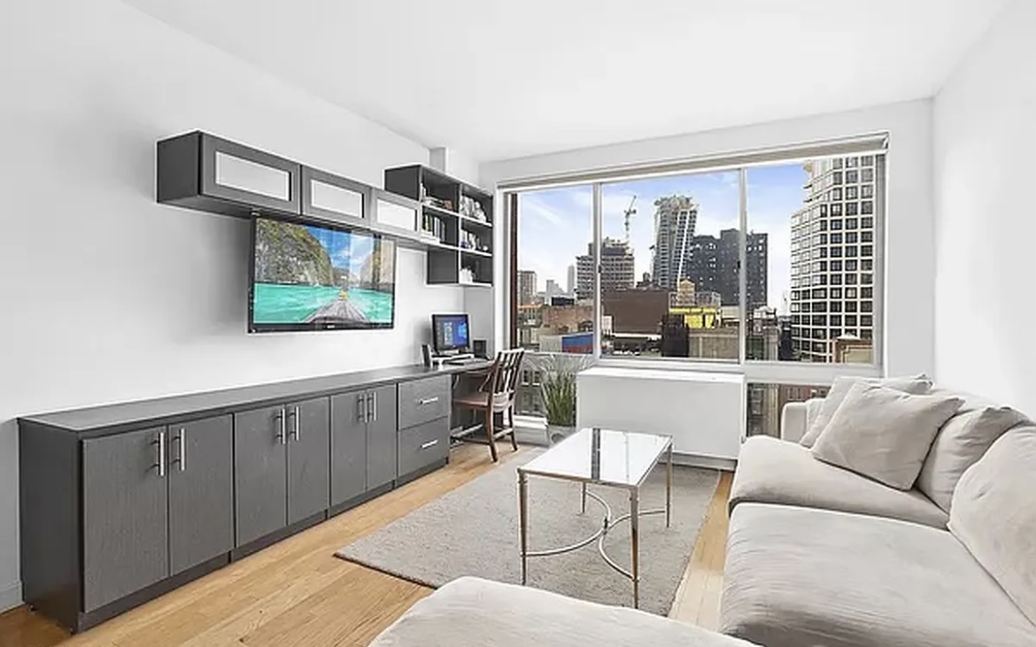 a living room with furniture and a flat screen tv