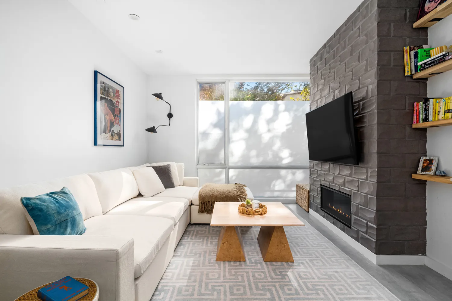 a living room with furniture fireplace and a flat screen tv