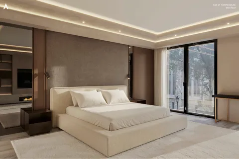 a bedroom with a large bed and a couch