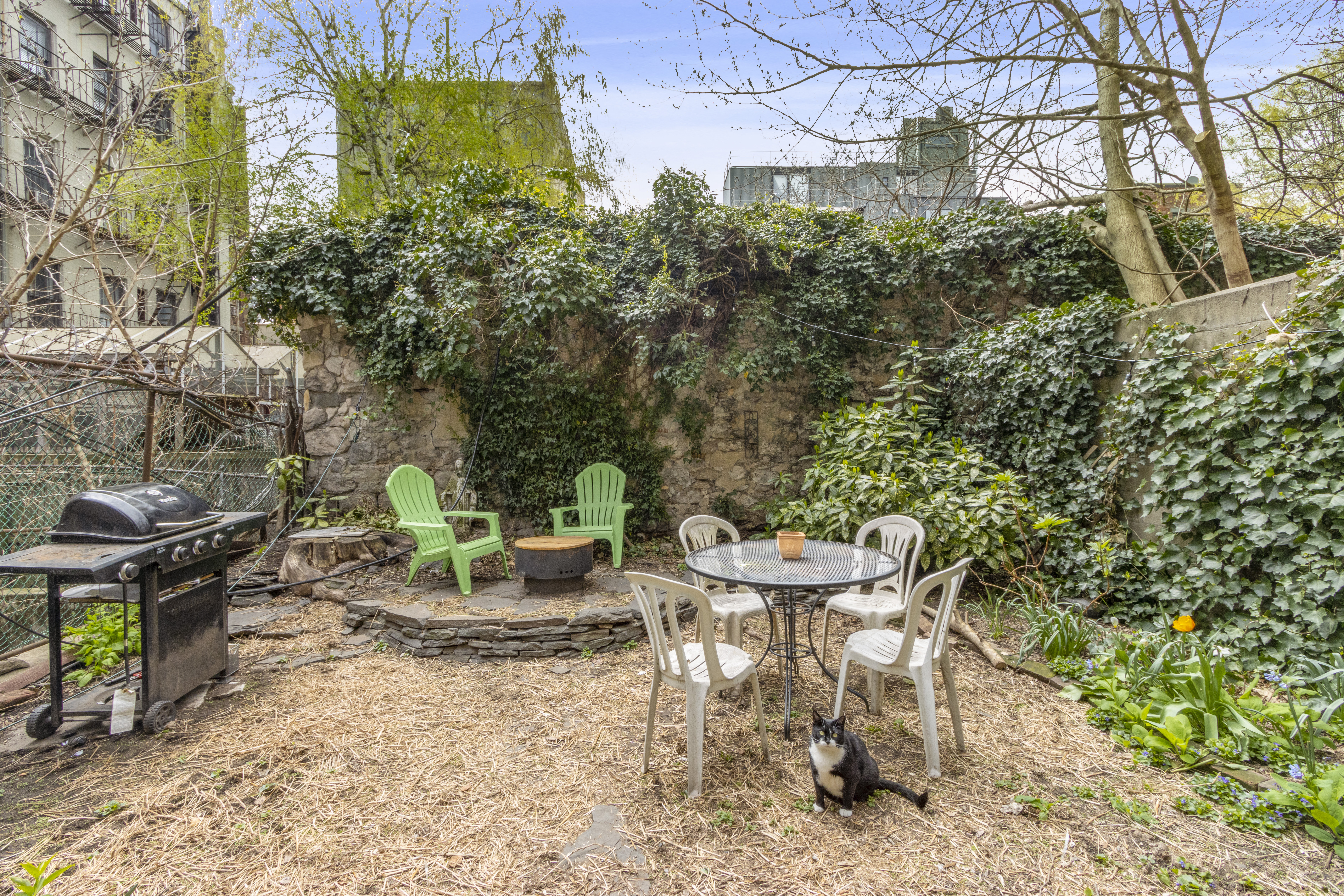 88 East 3rd Street, Unit 18 Manhattan, NY 10003 - Photo 4 of 6 a view of a chair and table in backyard