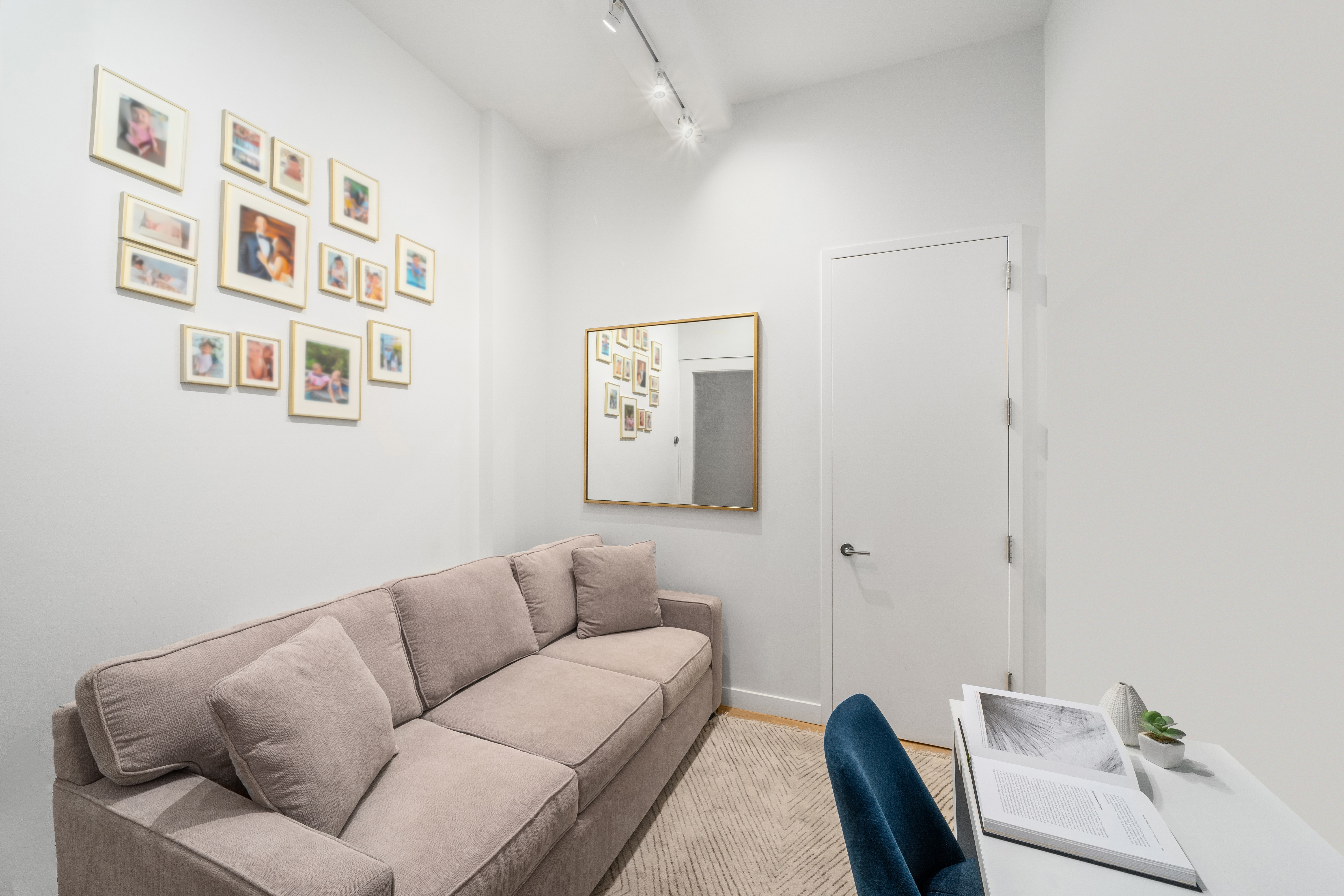 59 John Street, Unit 7D Manhattan, NY 10038 - Photo 9 of 10 a living room with furniture and a wall painting