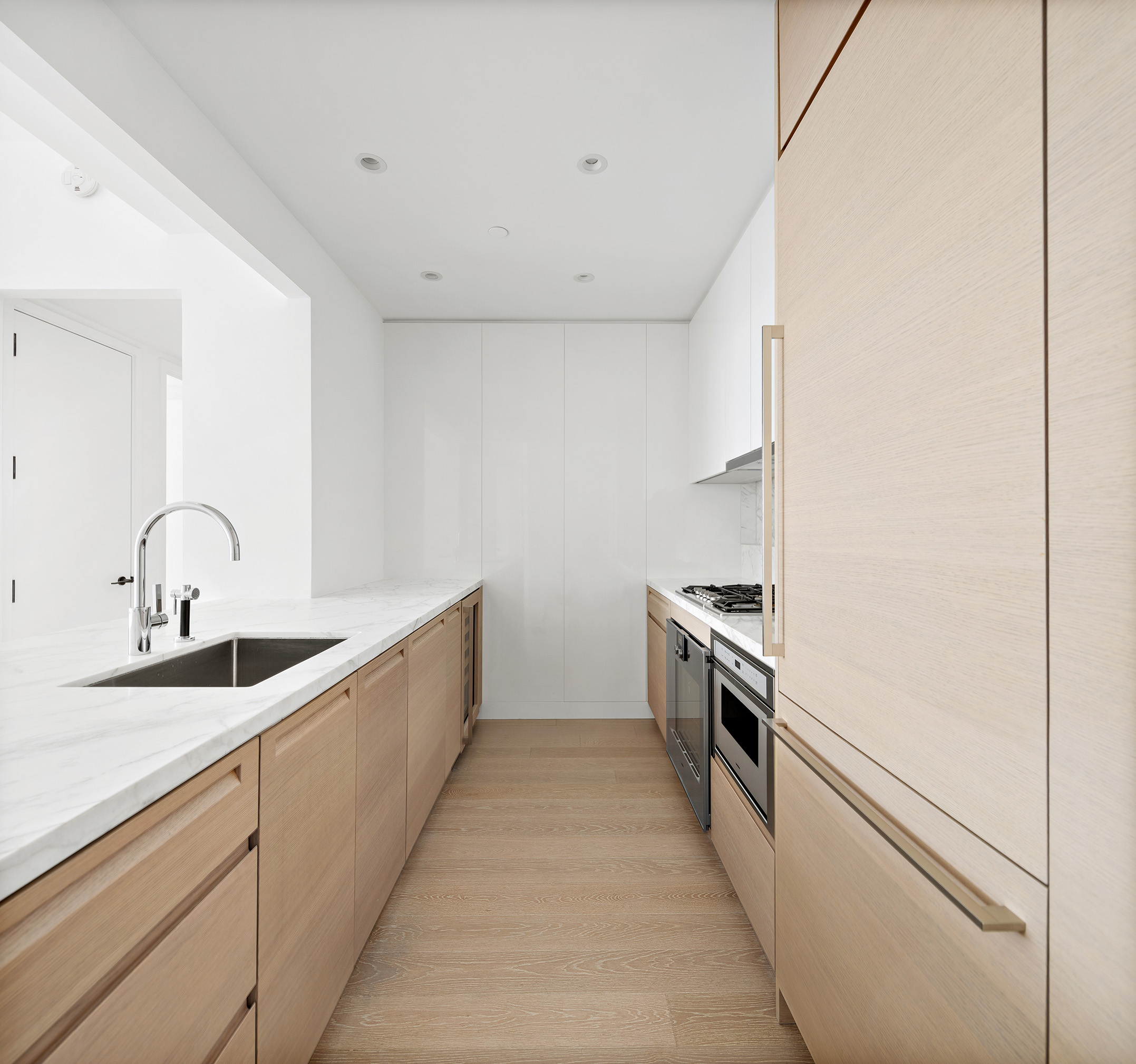 30 Riverside Boulevard, Unit 32G Manhattan, NY 10069 - Photo 4 of 9 a kitchen with a sink and stainless steel appliances