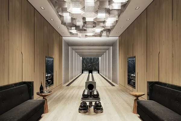 a hallway with furniture and a gate