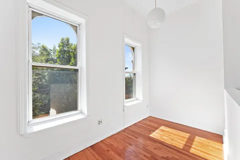 a view of a room that has a window in it