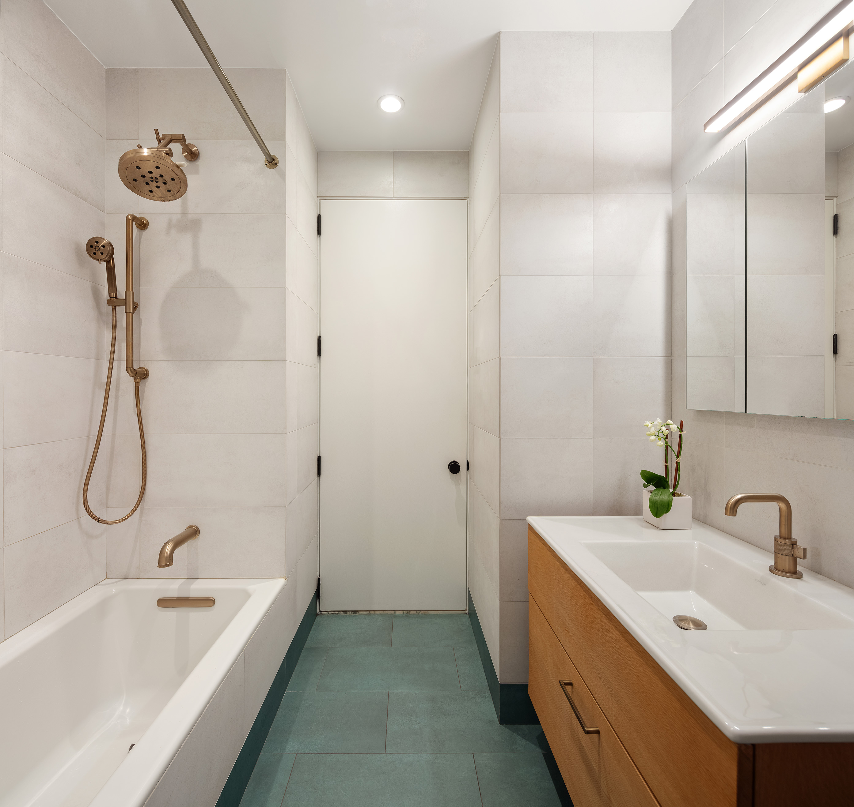 143 West 27th Street, Unit 2R Manhattan, NY 10001 - Photo 6 of 13 a bathroom with a tub sink and mirror