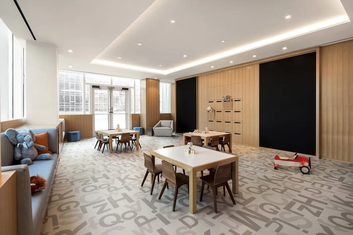 a large kitchen with a table and chairs