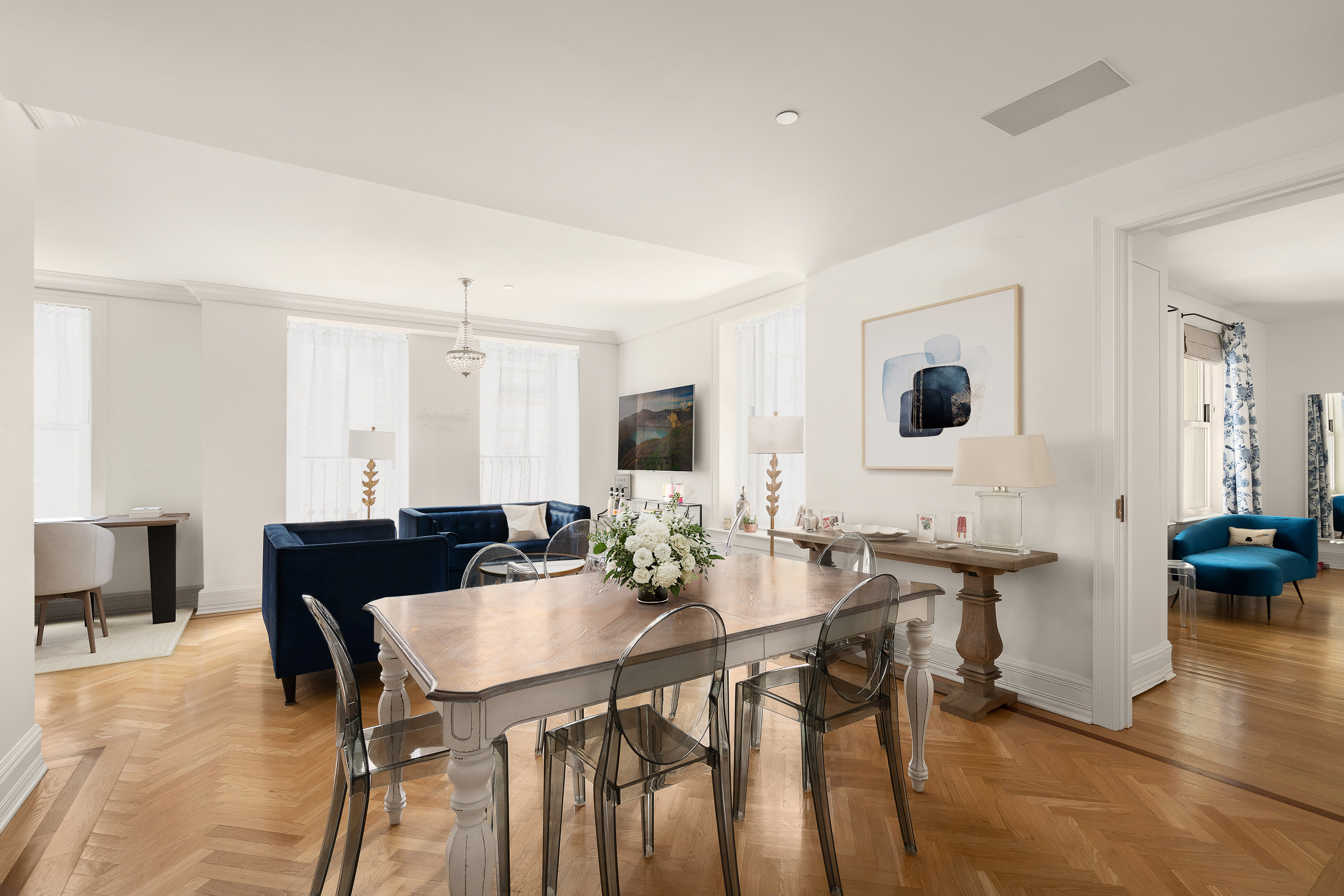 1 Central Park South, Unit 1804 Manhattan, NY 10019 - Photo 2 of 23 a view of a dining room with furniture and wooden floor