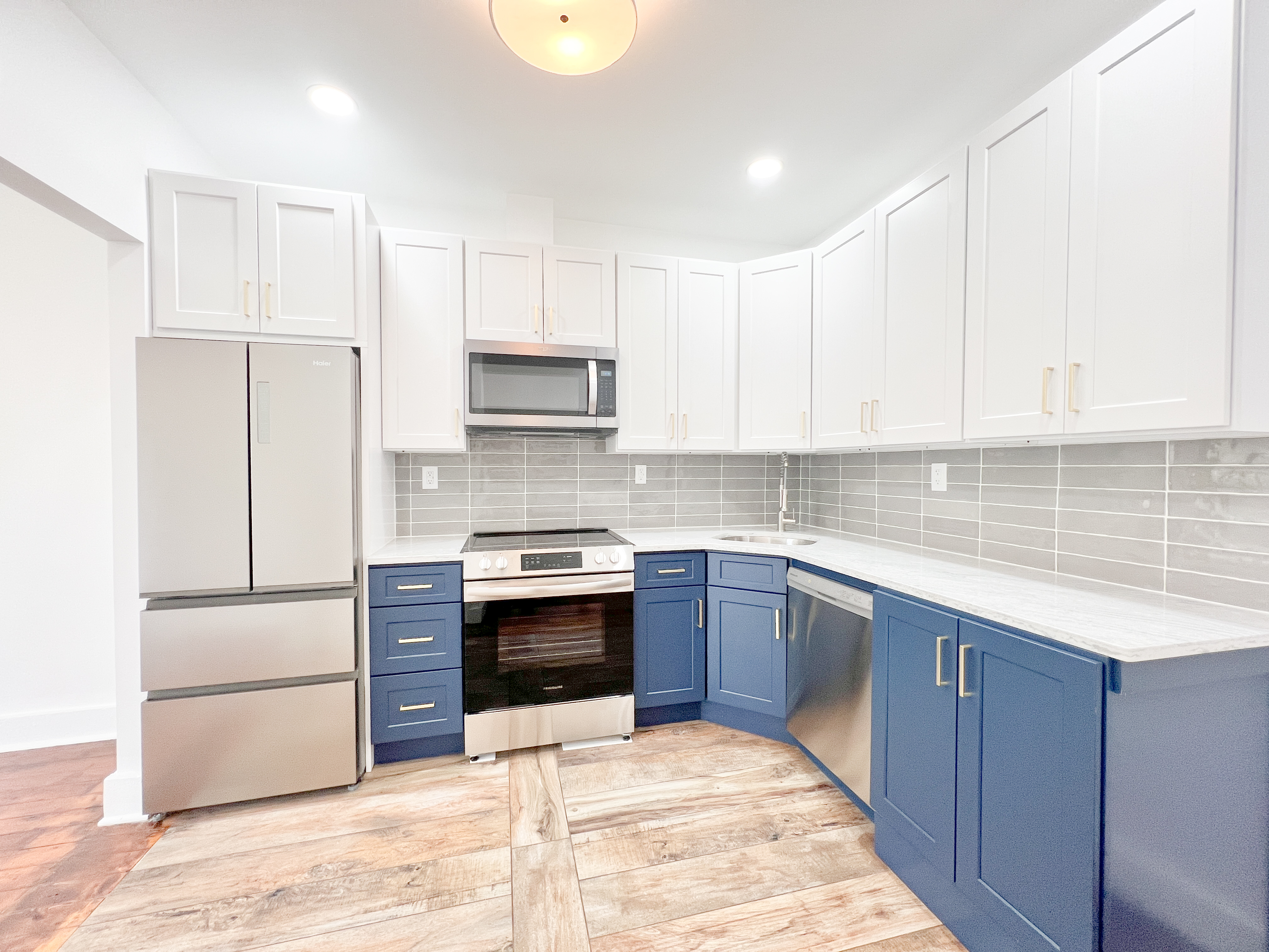 556 Vanderbilt Avenue, Unit 2 Brooklyn, NY 11238 - Photo 2 of 14 a kitchen with stainless steel appliances granite countertop a stove a sink and a refrigerator