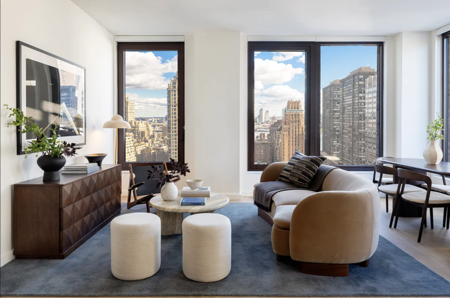 300 East 50th Street, Unit 18A Manhattan, NY 10022 - Photo 14 of 27 a living room with furniture and a large window