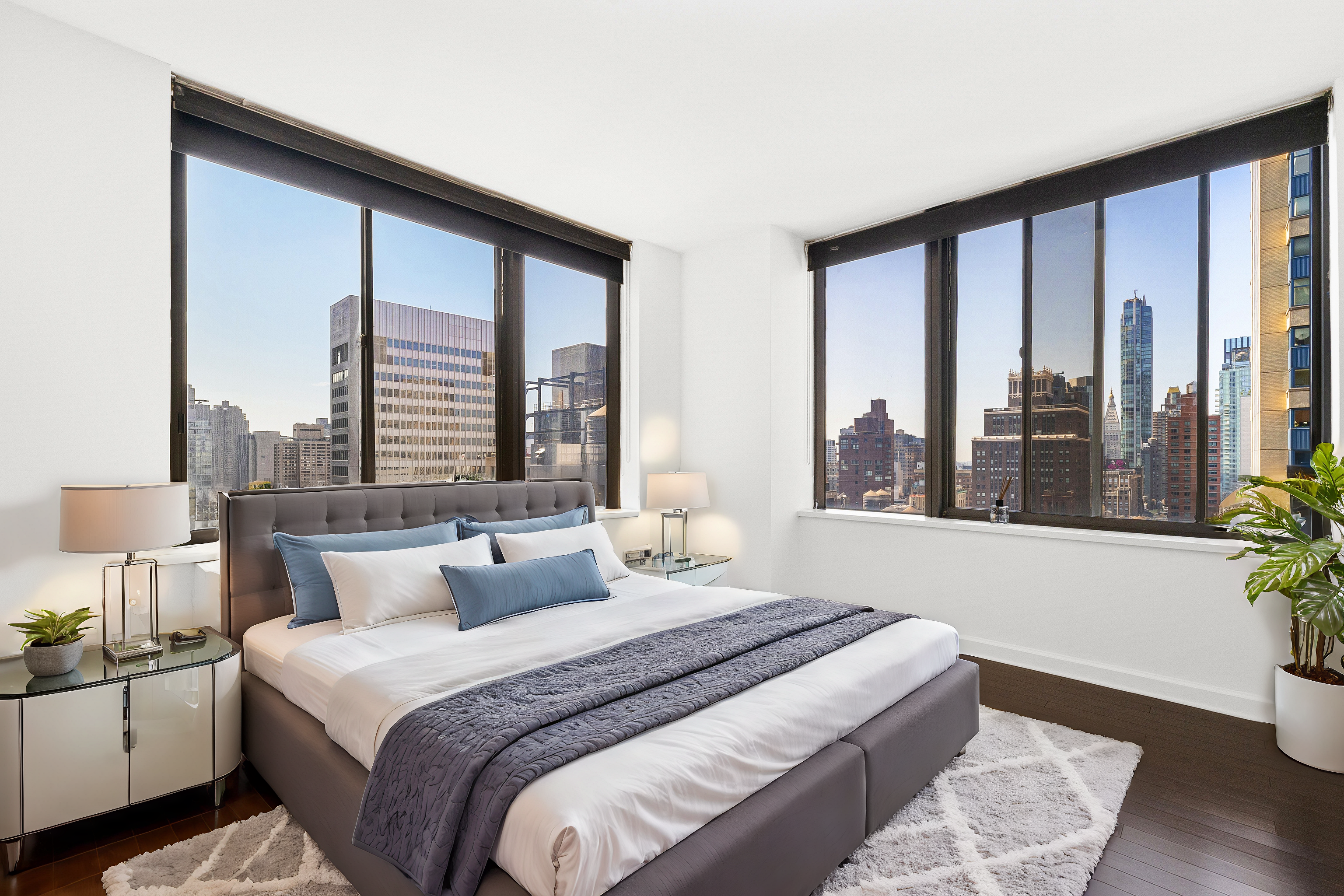 445 5th Avenue, Unit 26F Manhattan, NY 10016 - Photo 5 of 11 a bedroom with a large bed and a large window