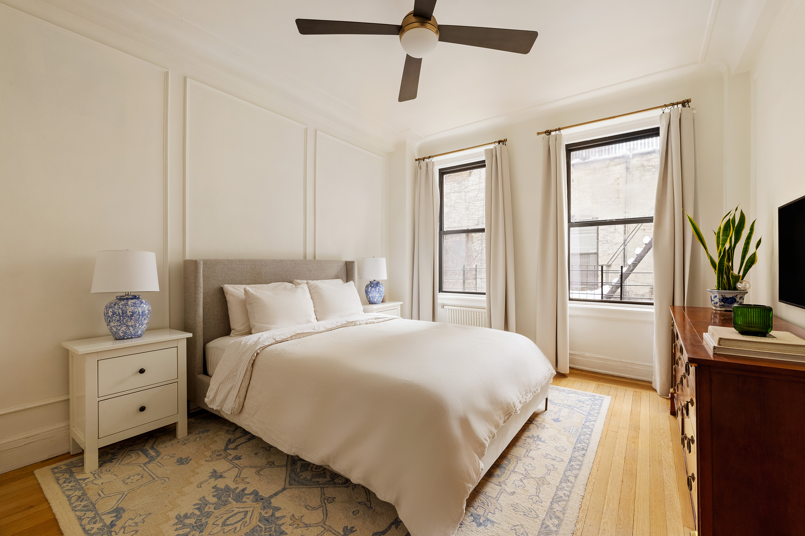 114 East 84th Street, Unit 3C Manhattan, NY 10028 - Photo 7 of 15 a bedroom with a bed and a window
