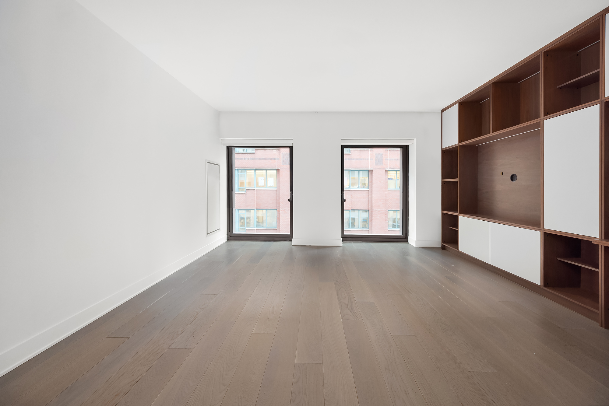 55 West 17th Street, Unit 603 Manhattan, NY 10011 - Photo 3 of 9 a view of empty room with windows