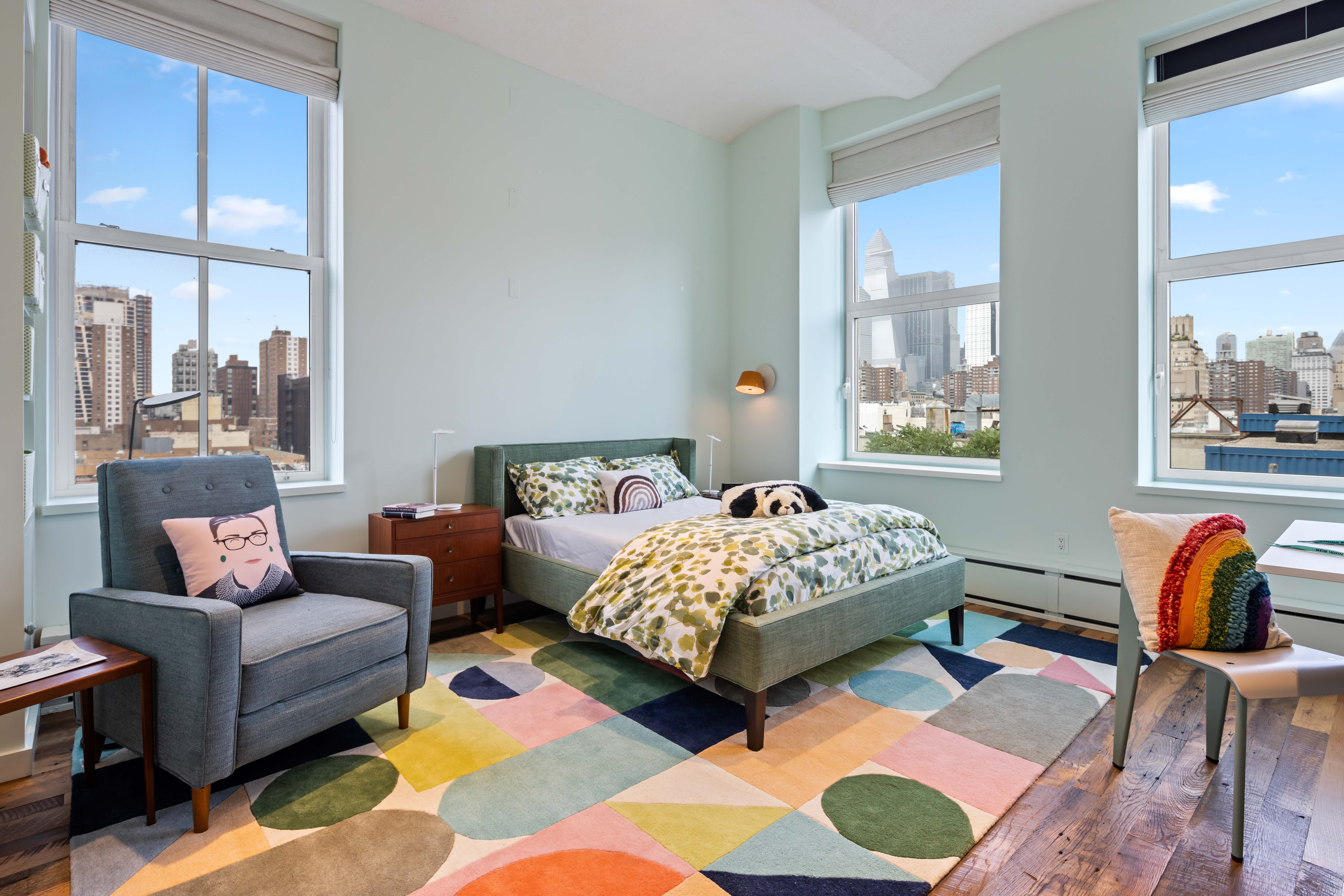 257 West 17th Street, Unit 7AB Manhattan, NY 10011 - Photo 13 of 21 a bedroom with a bed and a couch next to a window