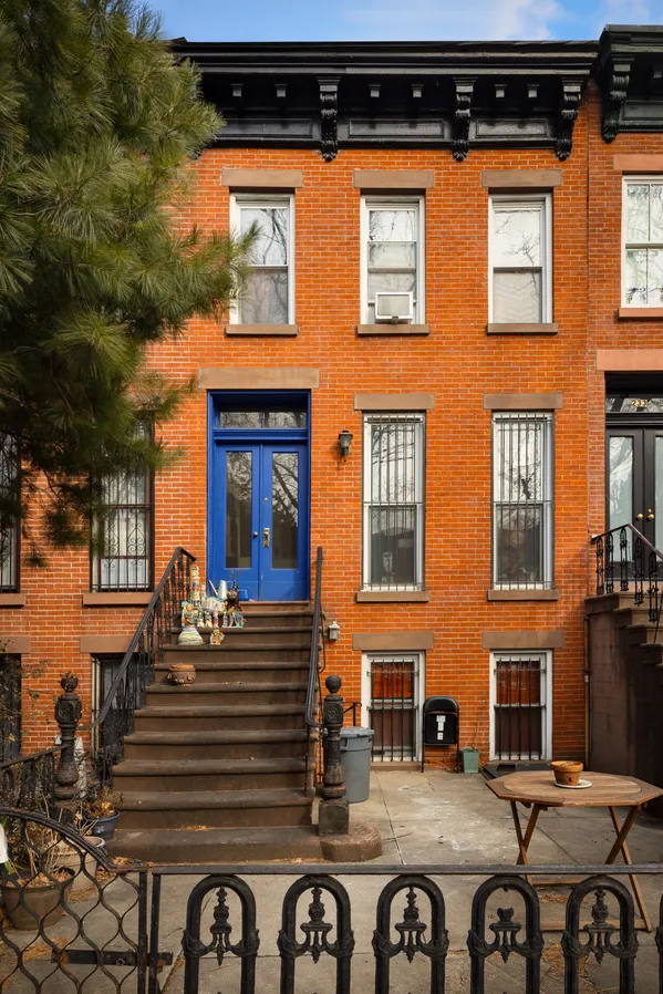 a front view of a building with many windows