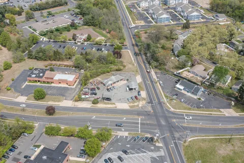 an aerial view of a house with a yard