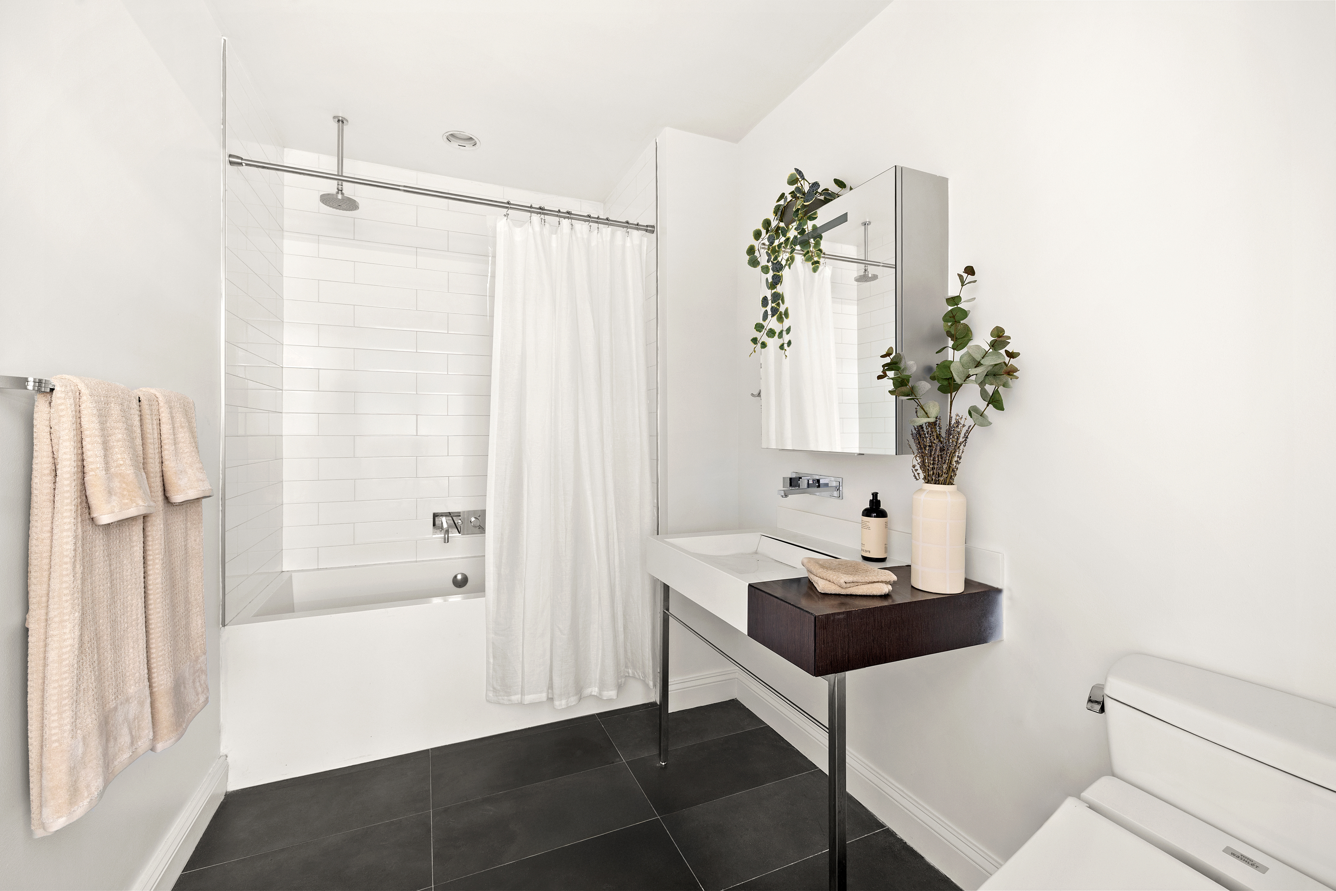 245 10th Avenue, Unit 2W Manhattan, NY 10001 - Photo 15 of 16 a room with table and chair