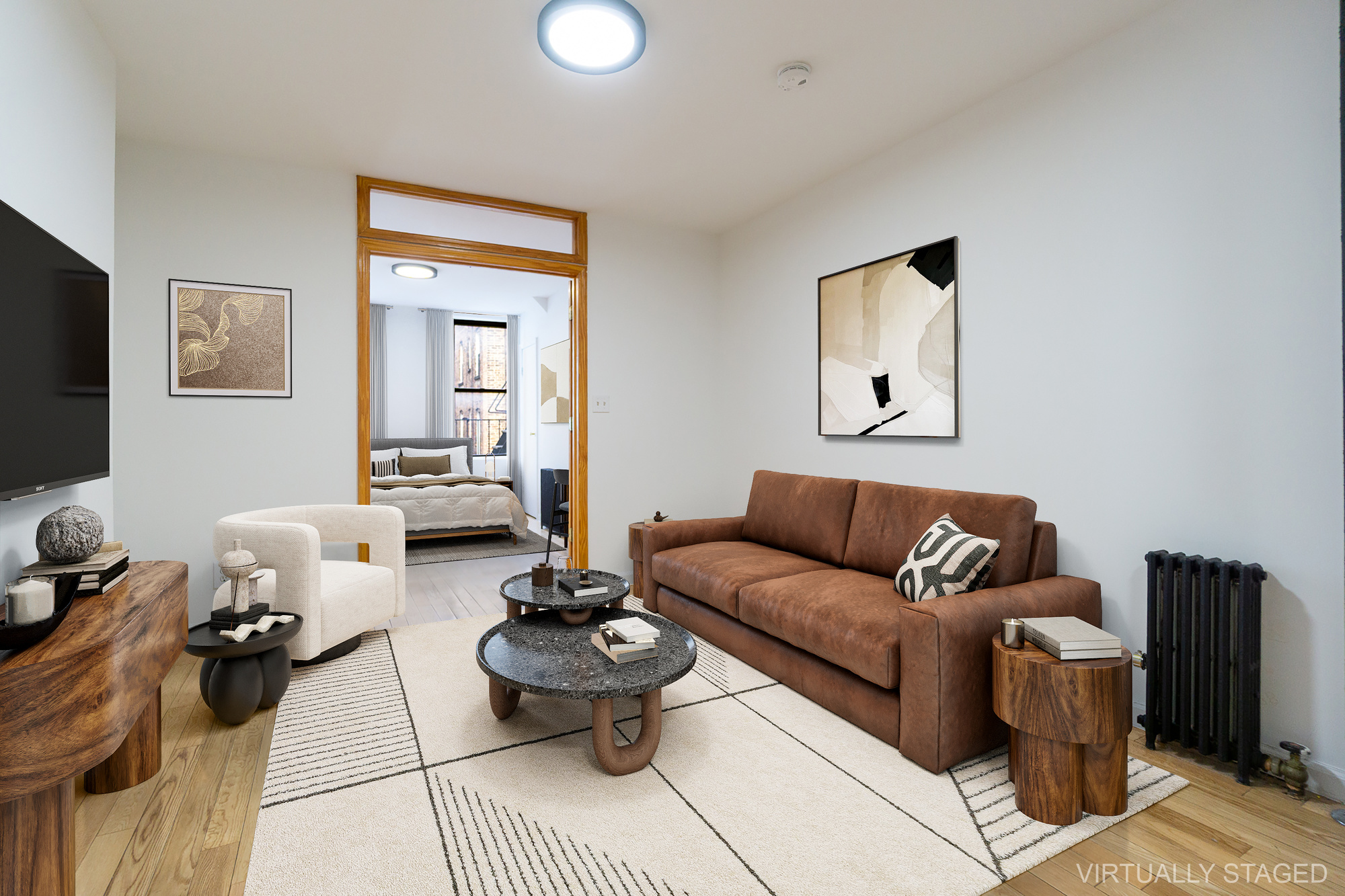 337 East 6th Street, Unit 9 Manhattan, NY 10003 - Photo 5 of 15 a living room with furniture