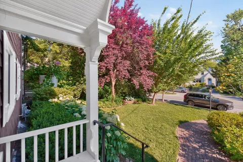 a view of a backyard with sitting area