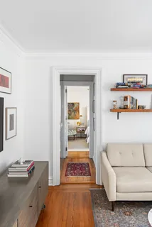 a hallway with a couch and a dresser