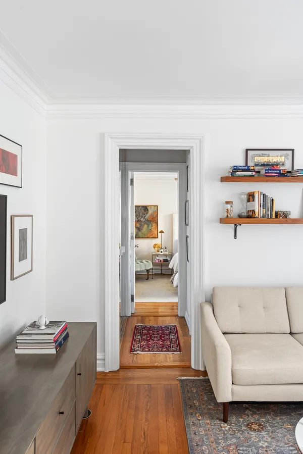 a hallway with a couch and a dresser