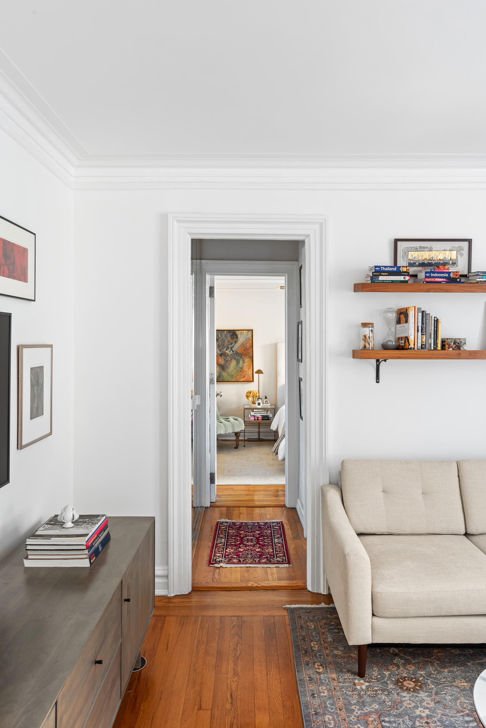 319 West 18th Street, Unit 5I Manhattan, NY 10011 - Photo 6 of 18 a hallway with a couch and a dresser