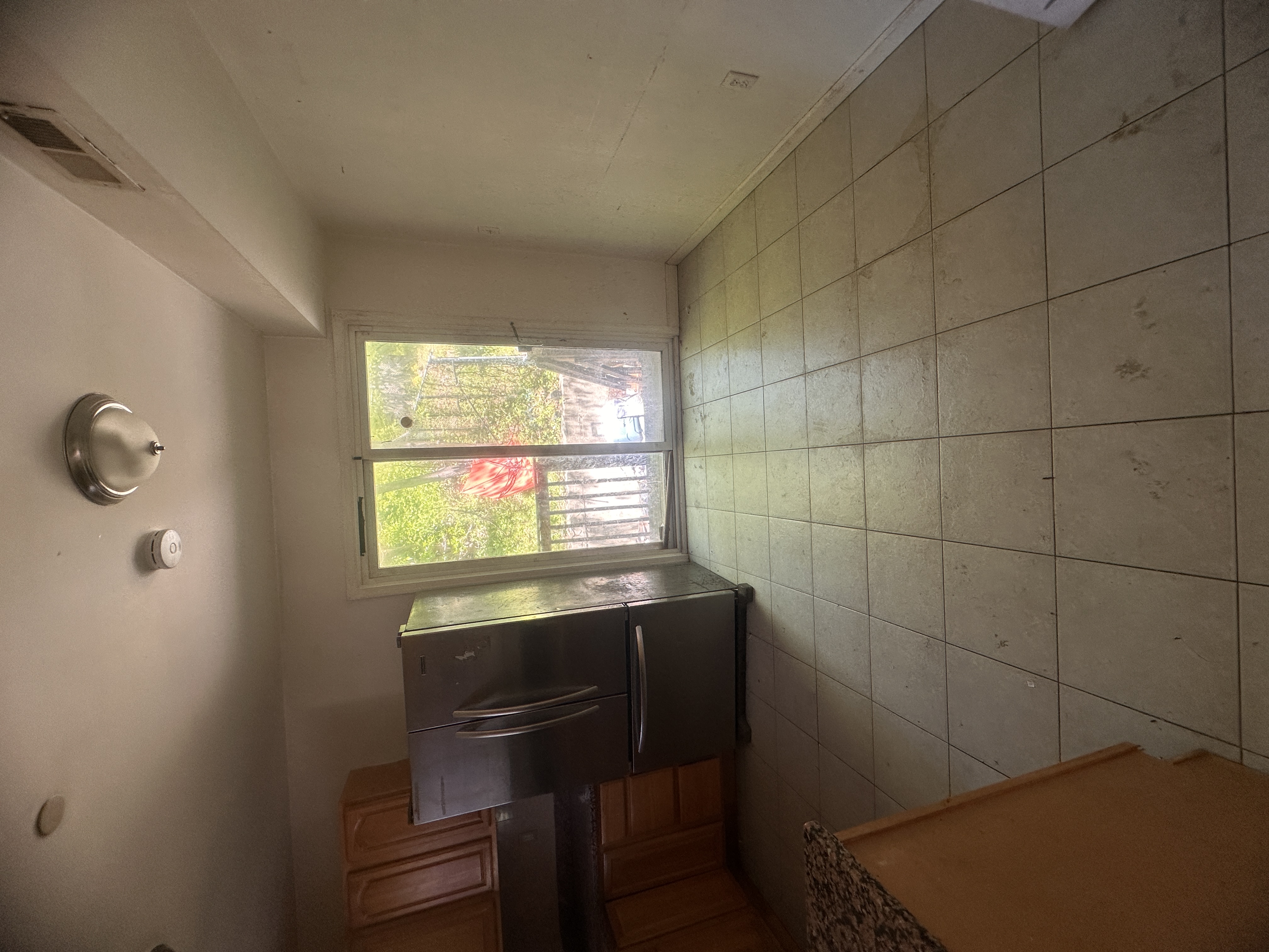 165 Brighton Avenue Staten Island, NY 10301 - Photo 4 of 8 a living room with a couch